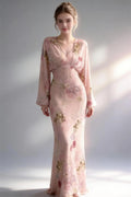 Model wearing pink floral print chiffon long sleeve v-neck maxi dress
