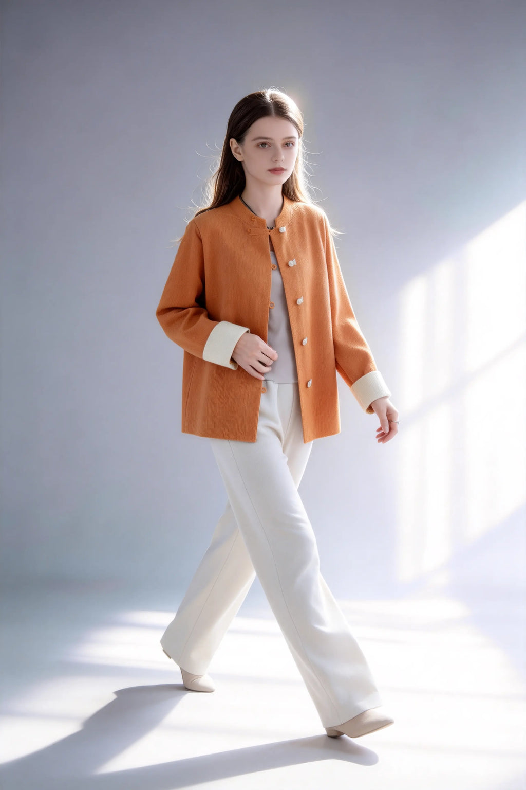 Model wearing new chinese style orange knit cardigan contrast frog button stand collar loose coat