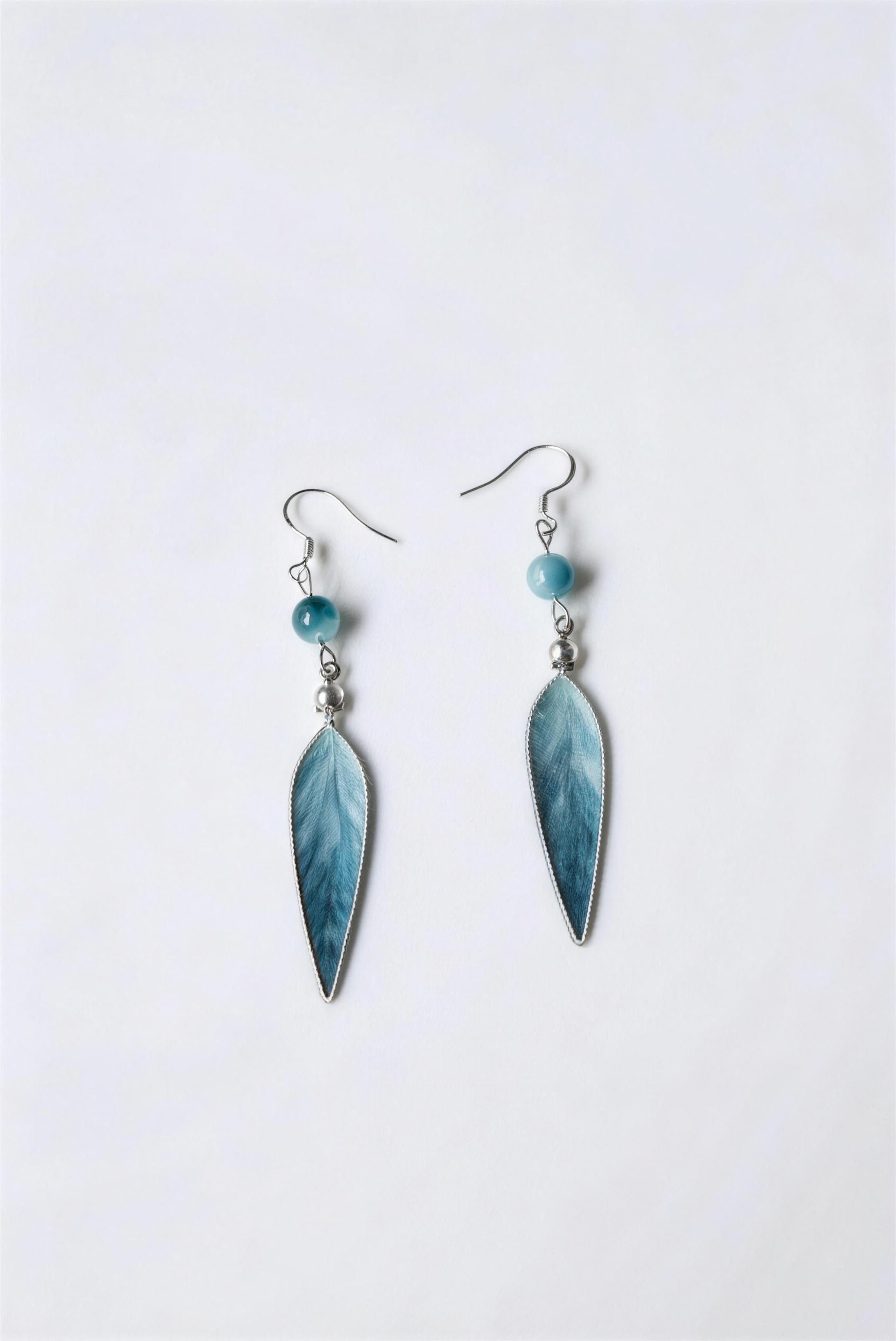 Model wearing blue jiangnan intangible cultural heritage ronghua bamboo leaf earrings
