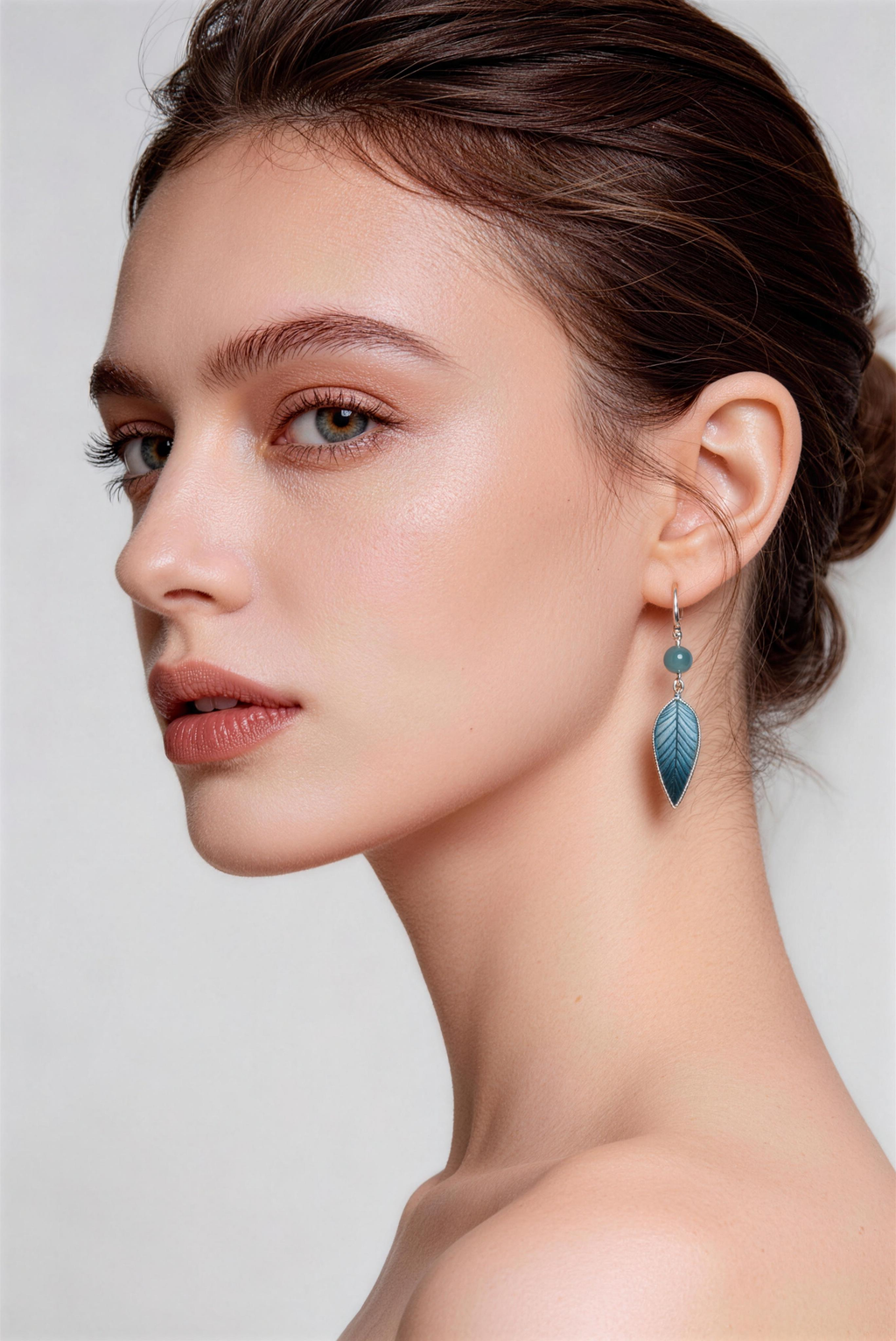 Model wearing blue jiangnan intangible cultural heritage ronghua bamboo leaf earrings