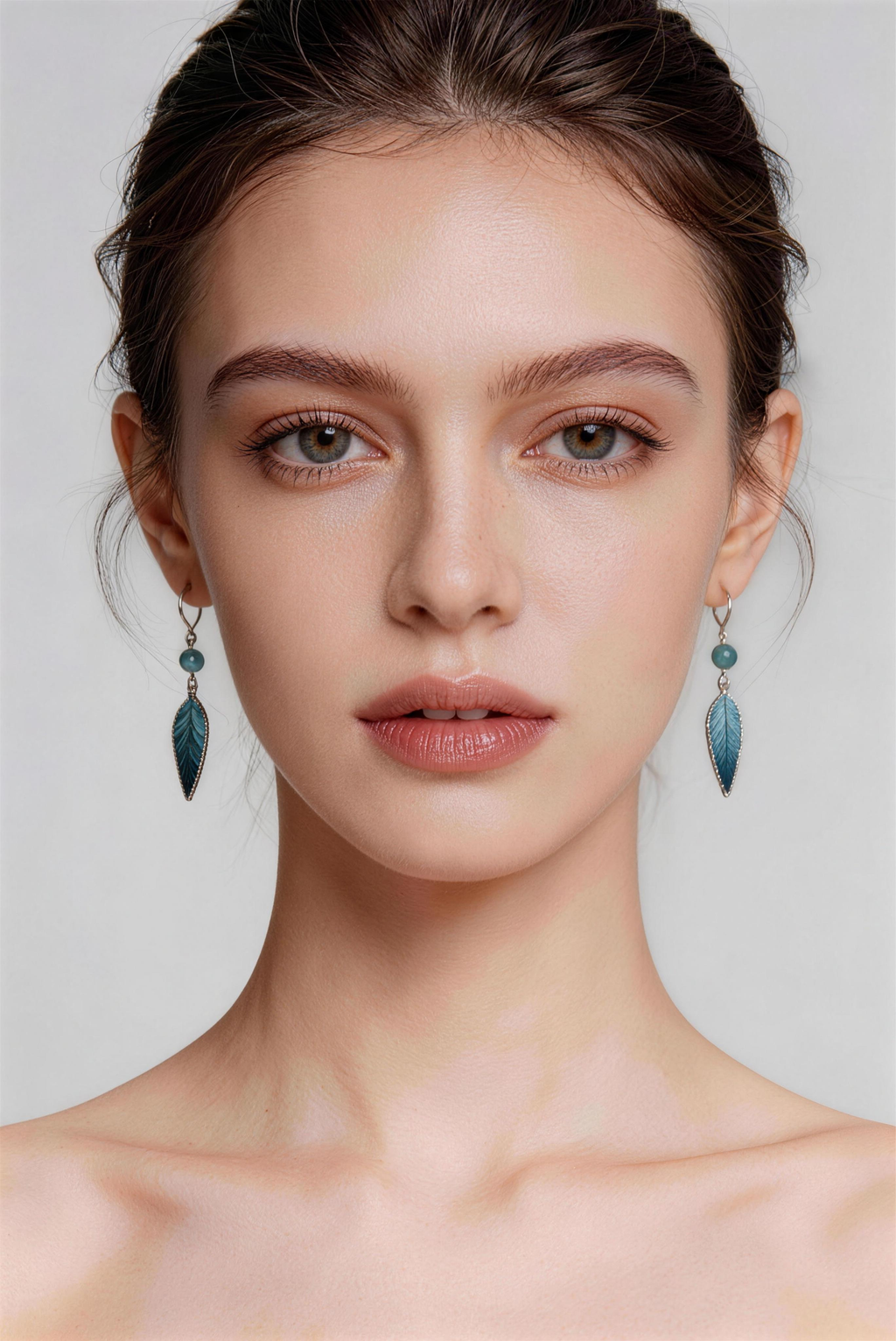 Model wearing blue jiangnan intangible cultural heritage ronghua bamboo leaf earrings