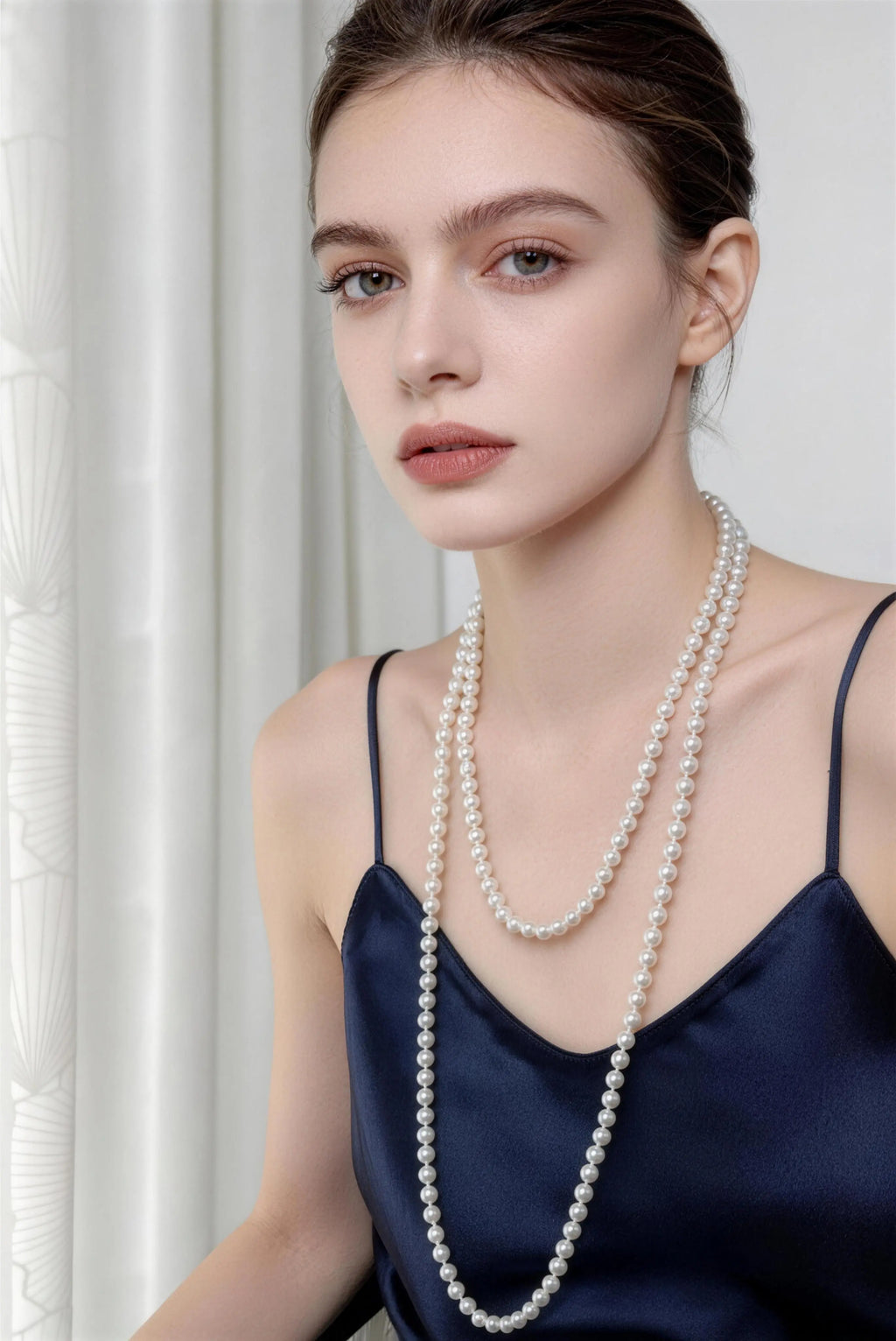 Model wearing white multi-layer pearl necklace - long vintage french style pearl chain for women