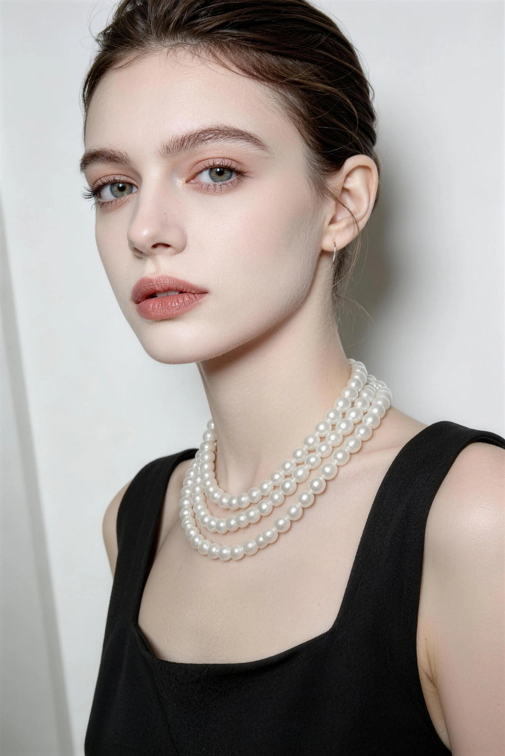 Model wearing white multi-layer pearl necklace - long vintage french style pearl chain for women
