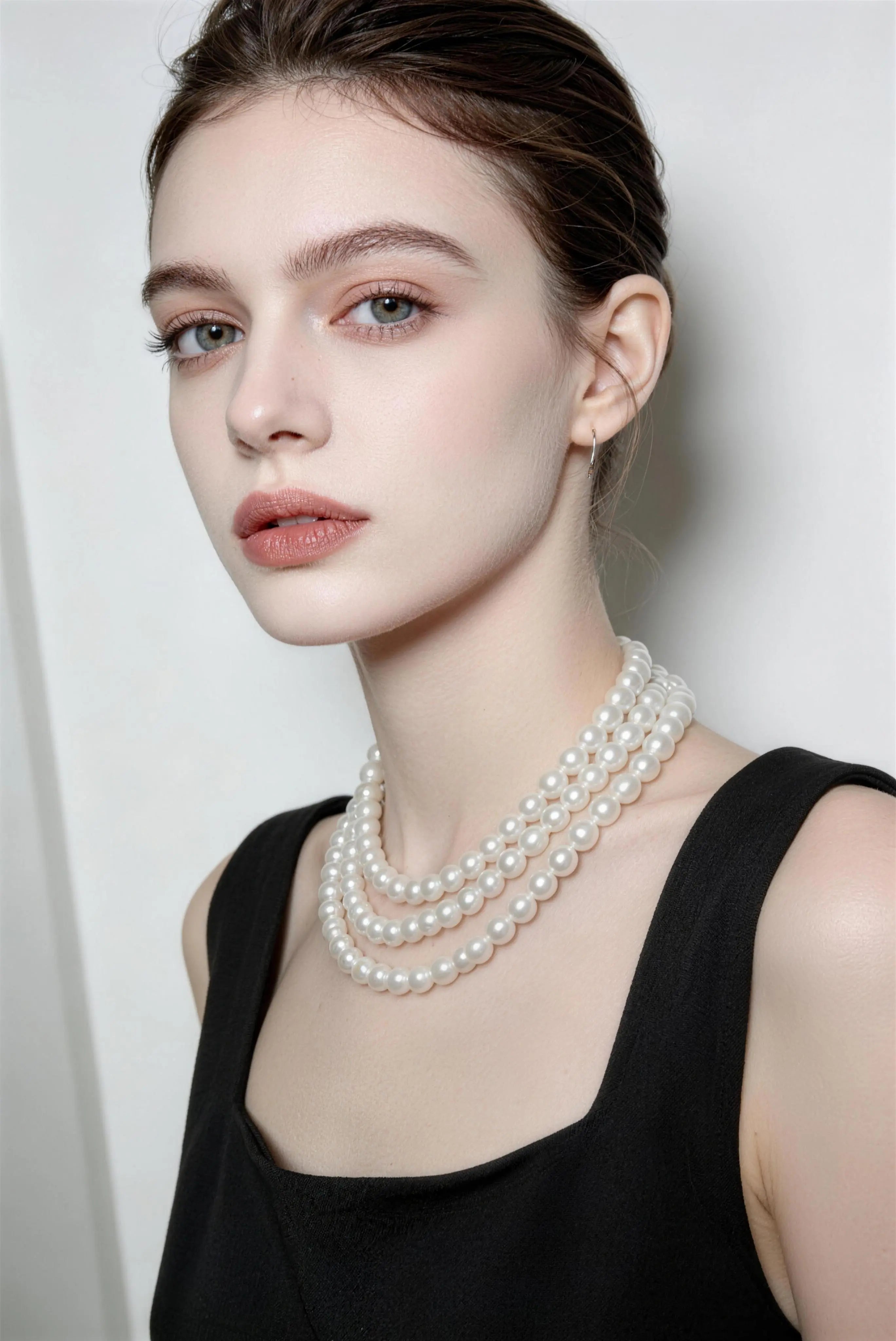 Model wearing white multi-layer pearl necklace - long vintage french style pearl chain for women