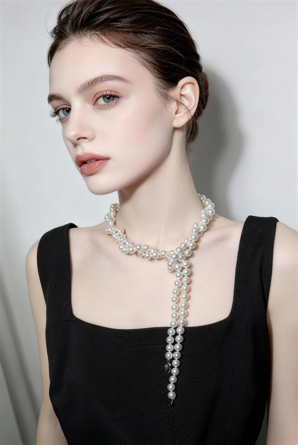Model wearing white multi-layer pearl necklace - long vintage french style pearl chain for women