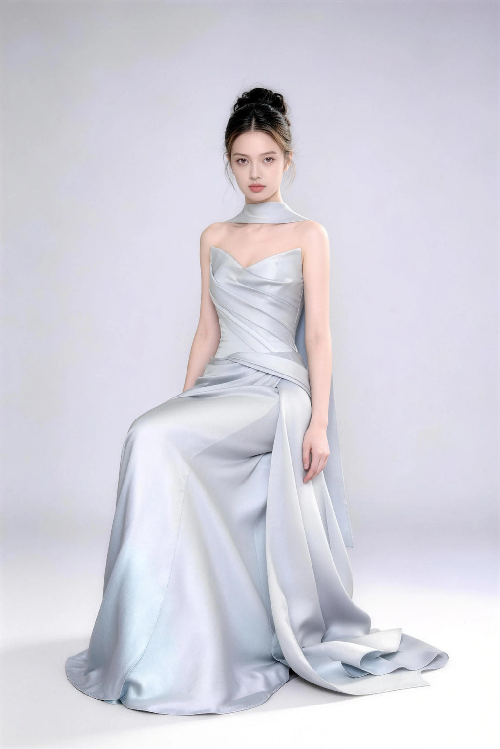 Model wearing Phoehua premium ice blue satin mermaid gown, minimalist studio shot highlighting luxurious fabric texture, graceful posture and sophisticated design.