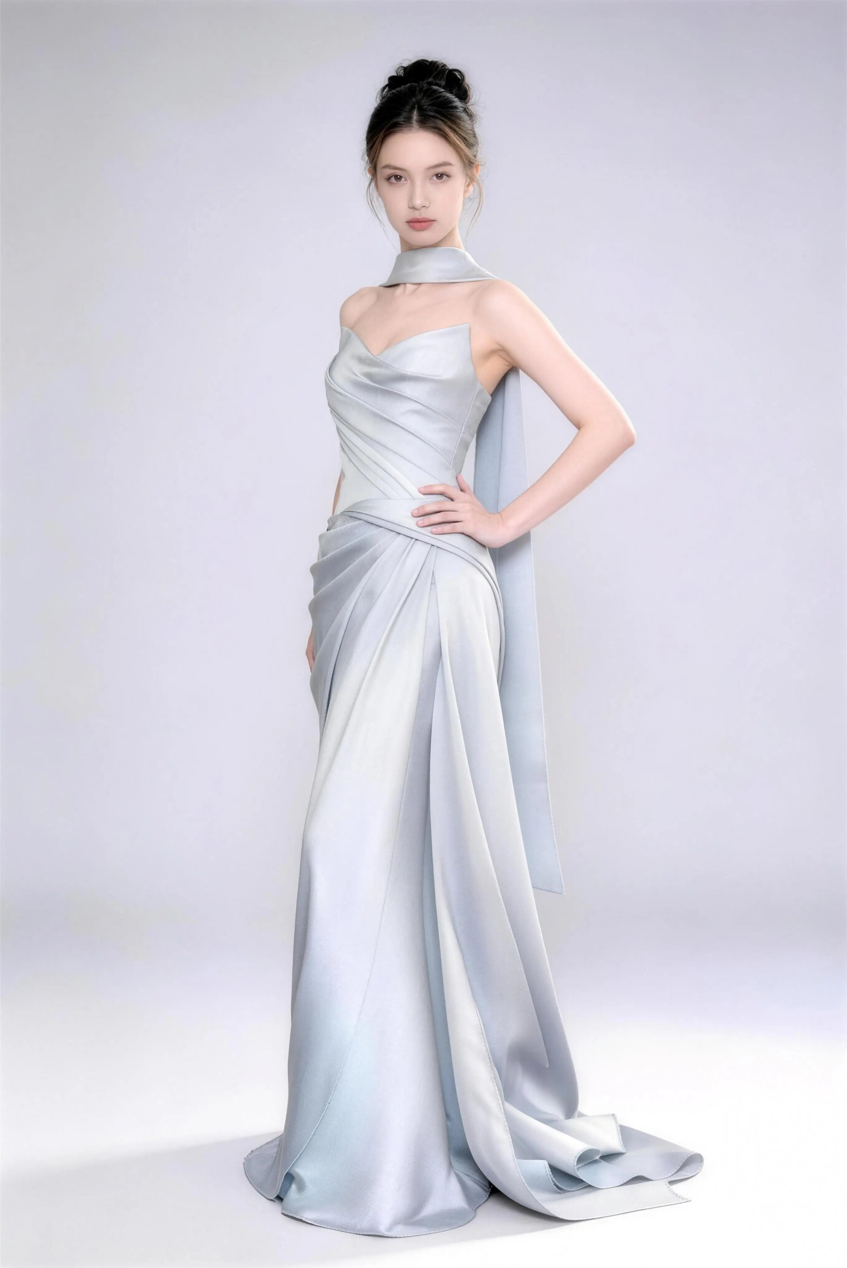 Model wearing Phoehua premium ice blue satin mermaid gown, minimalist studio shot highlighting luxurious fabric texture, graceful posture and sophisticated design.
