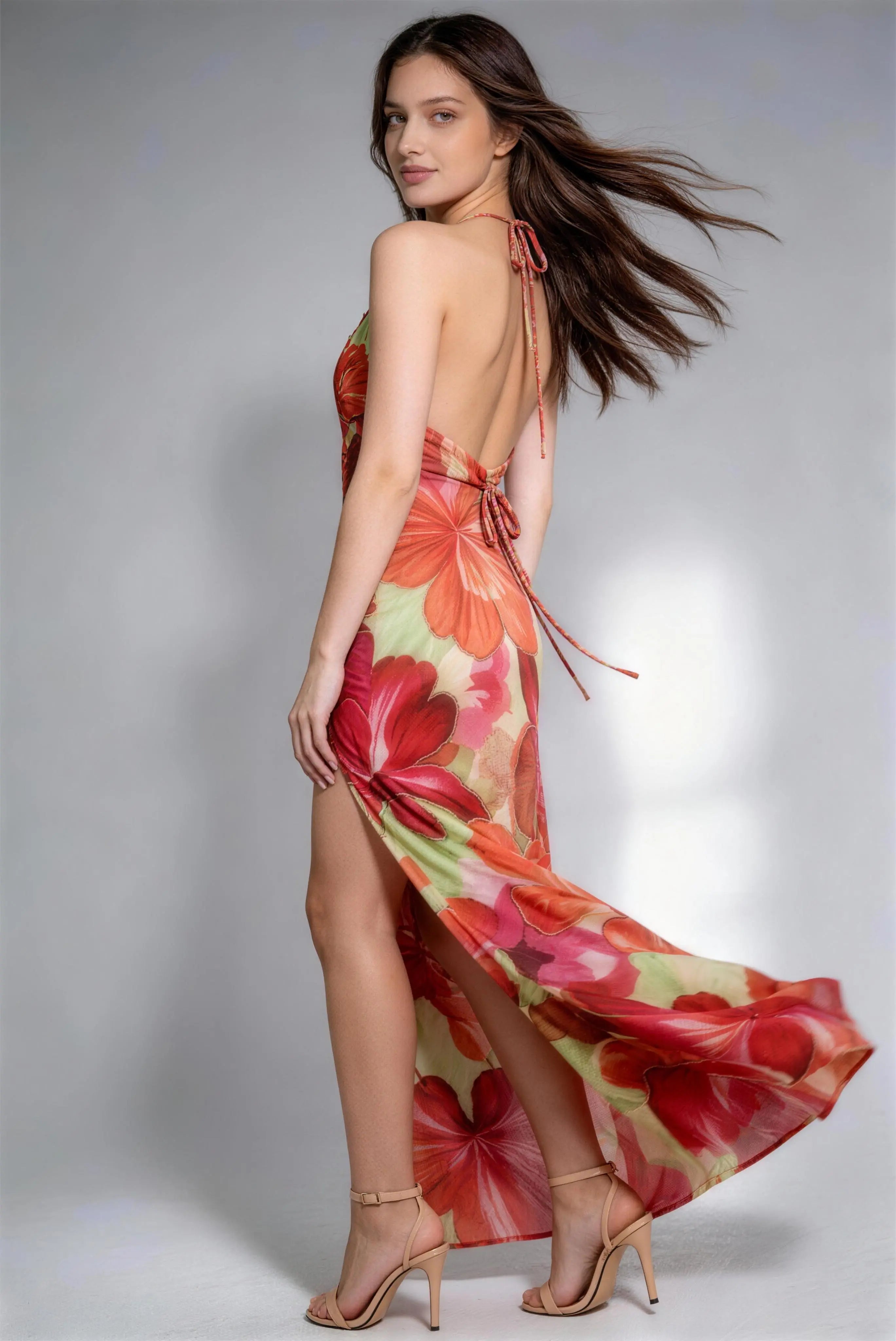 Model wearing floral halter backless maxi dress