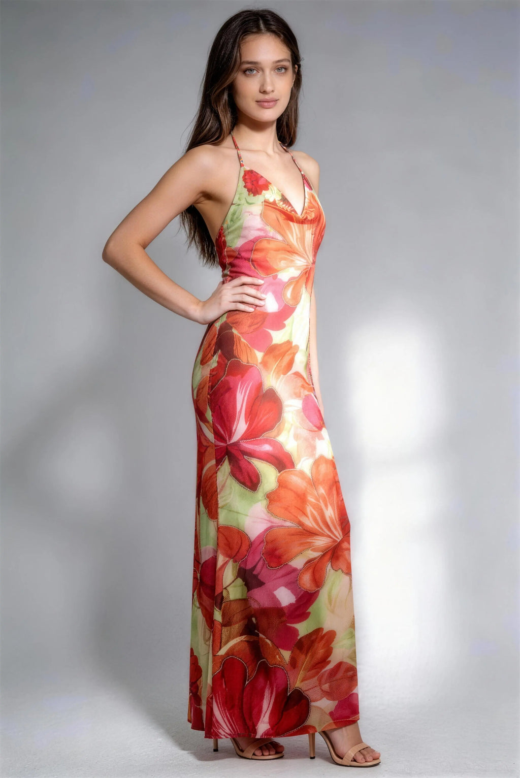 Model wearing floral halter backless maxi dress