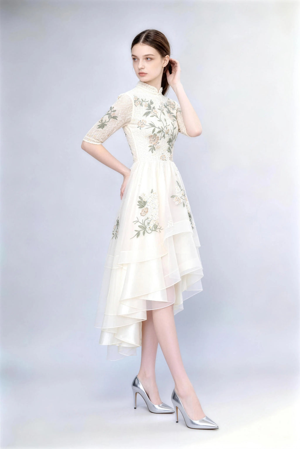 Model wearing white high neck lace floral embroidery high-low dress half sleeve a-line cocktail party dress for wedding guest or tea party