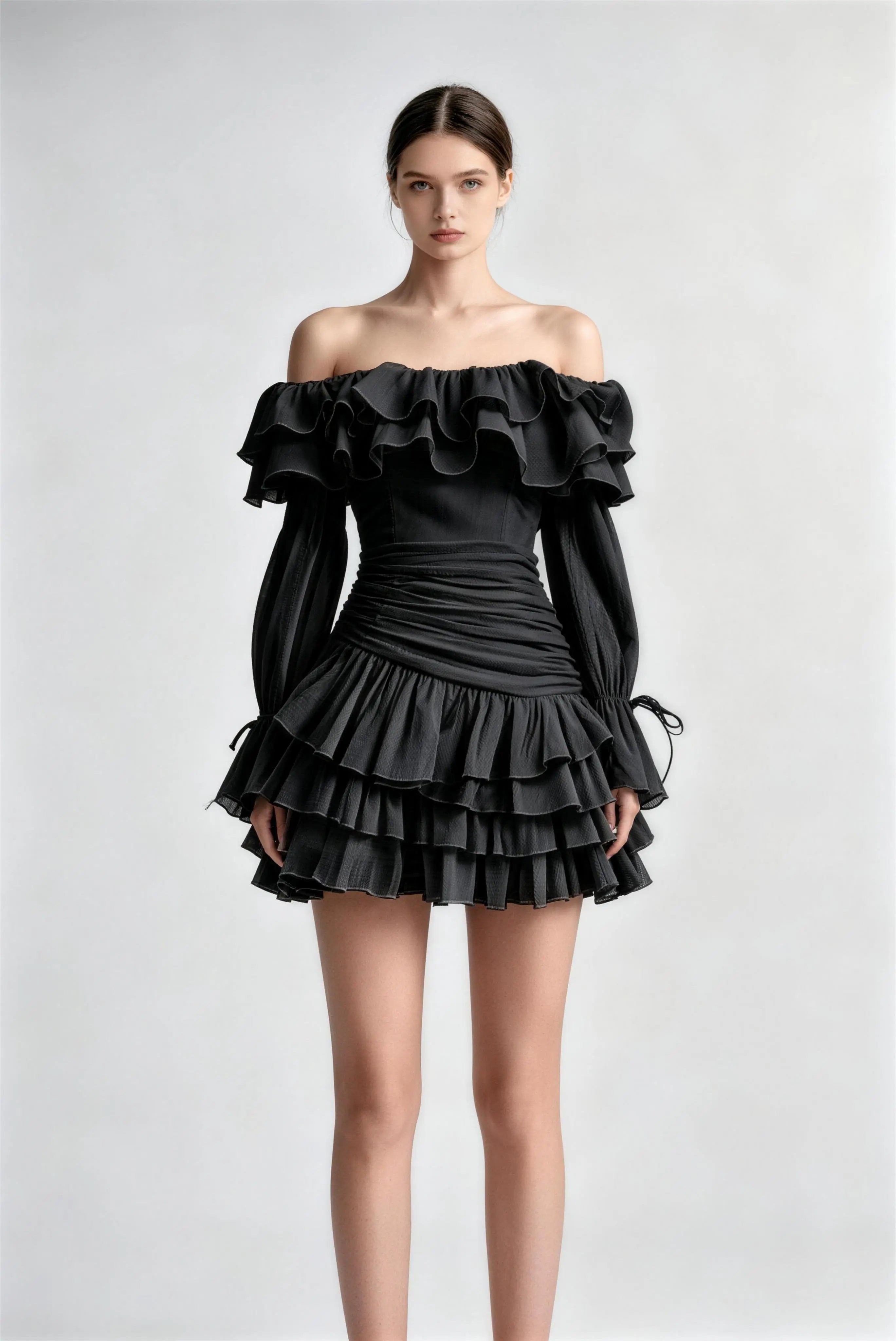 Model wearing black off-shoulder ruffle chiffon mini dress
