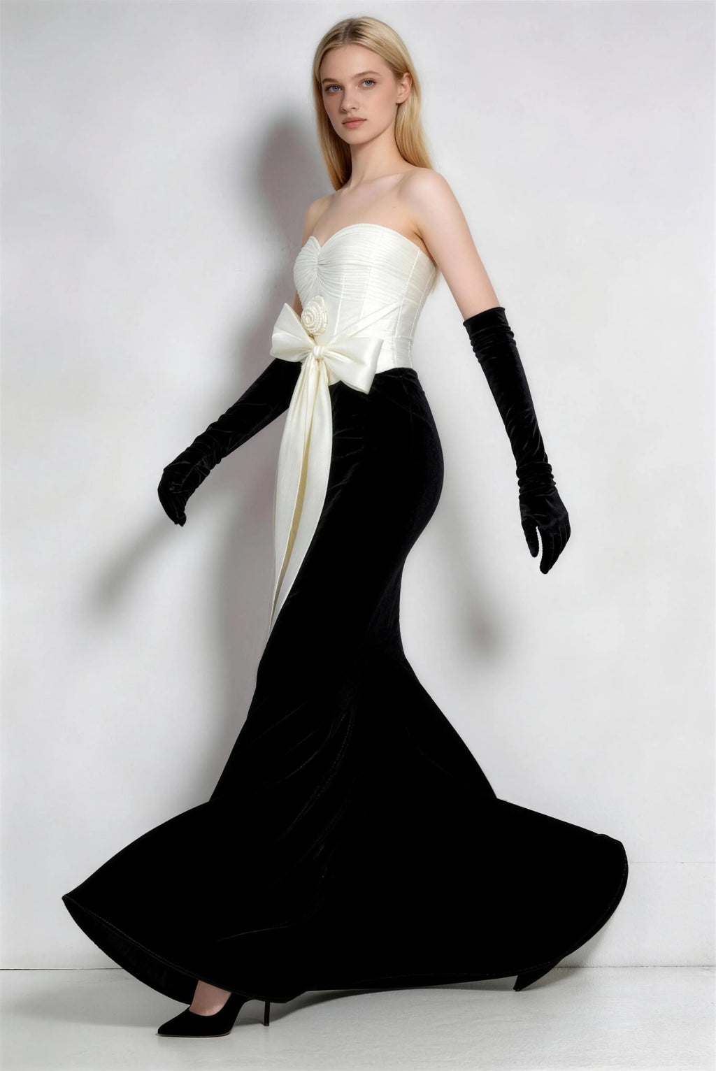 Phoehua Walking Pose of Black White Velvet Mermaid Evening Gown, Floor‑Length Train Formal Dress with Satin Bow & Matching Gloves