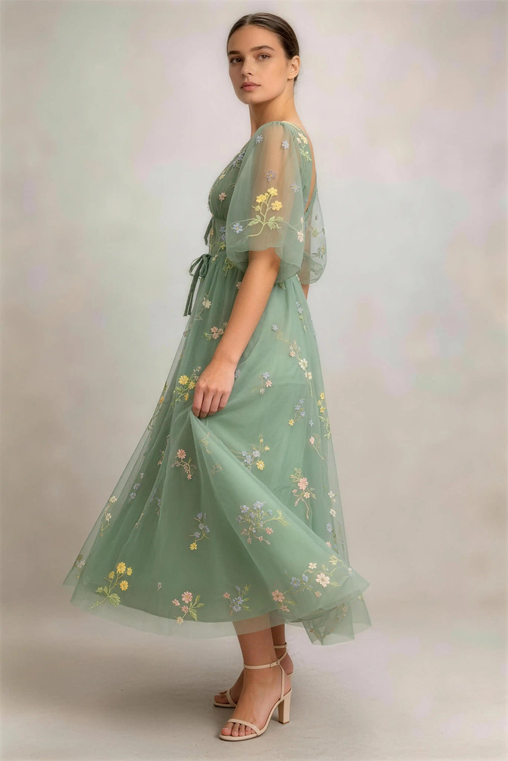 Model wearing green puff sleeve floral embroidered tulle a‑line midi formal dress