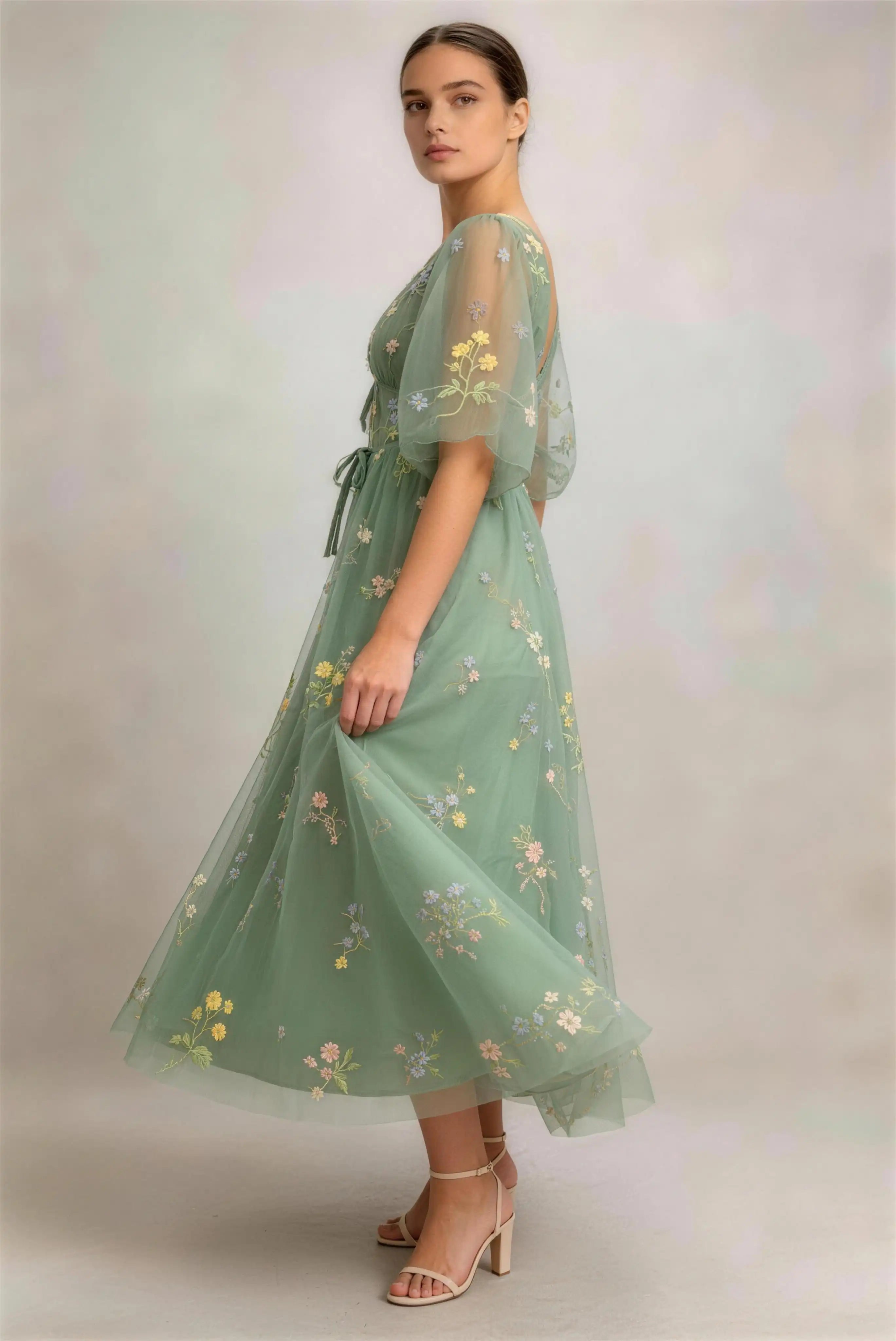 Model wearing green puff sleeve floral embroidered tulle a‑line midi formal dress