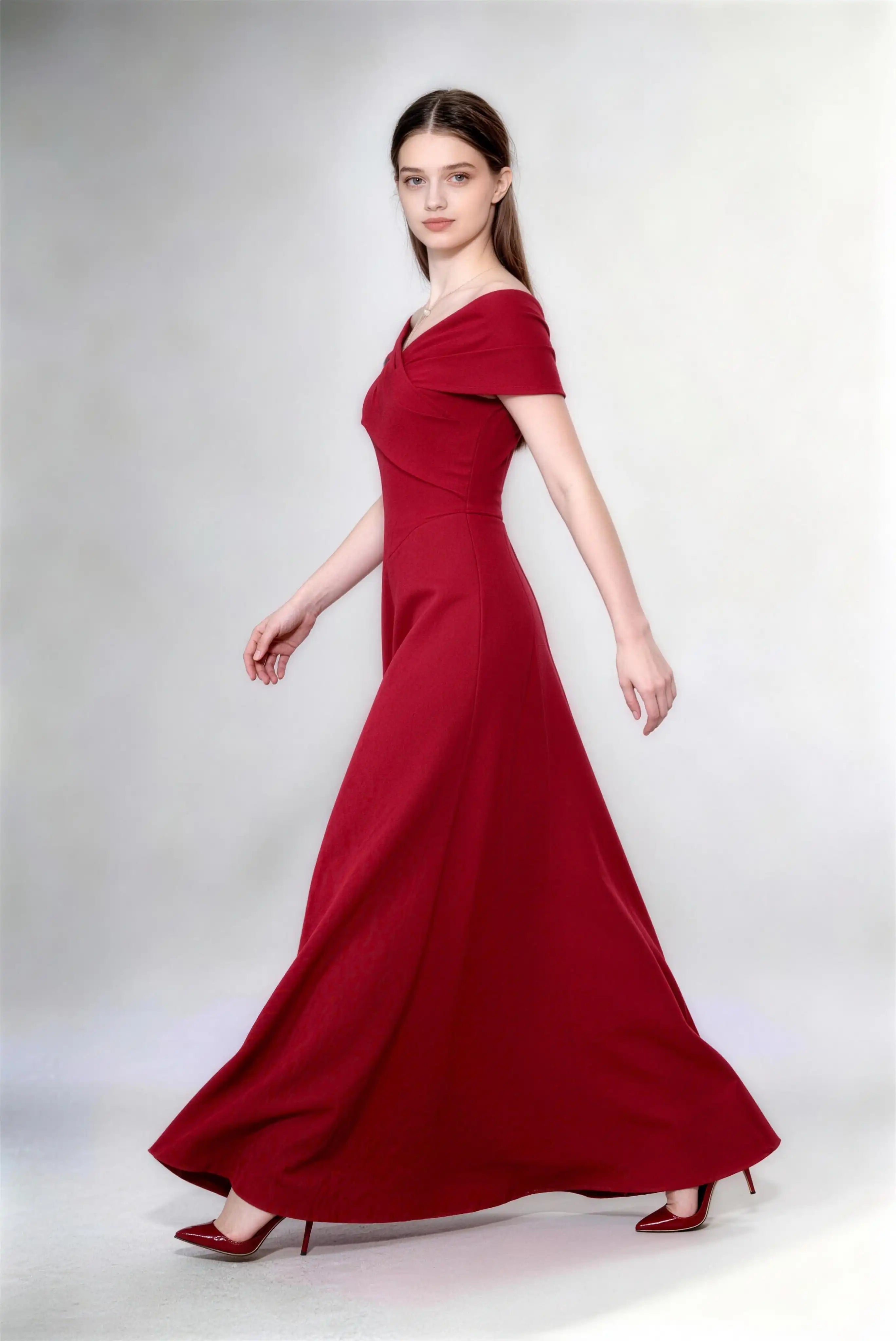 Phoehua Walking Pose of Burgundy Minimalist Elegant Bridesmaid Evening Gown, Off‑Shoulder Fold‑Over V‑Neck High‑Waist A‑Line Long Formal Dress