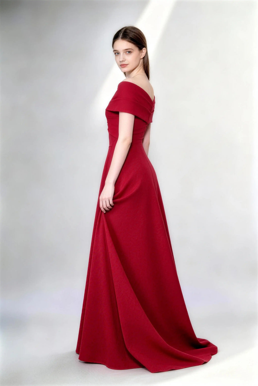 Phoehua Side Twirl Pose of Burgundy Luxury Long Evening Gown, Off‑Shoulder Fold‑Over V‑Neck High‑Waist A‑Line Formal Bridesmaid Dress With Sweep Train