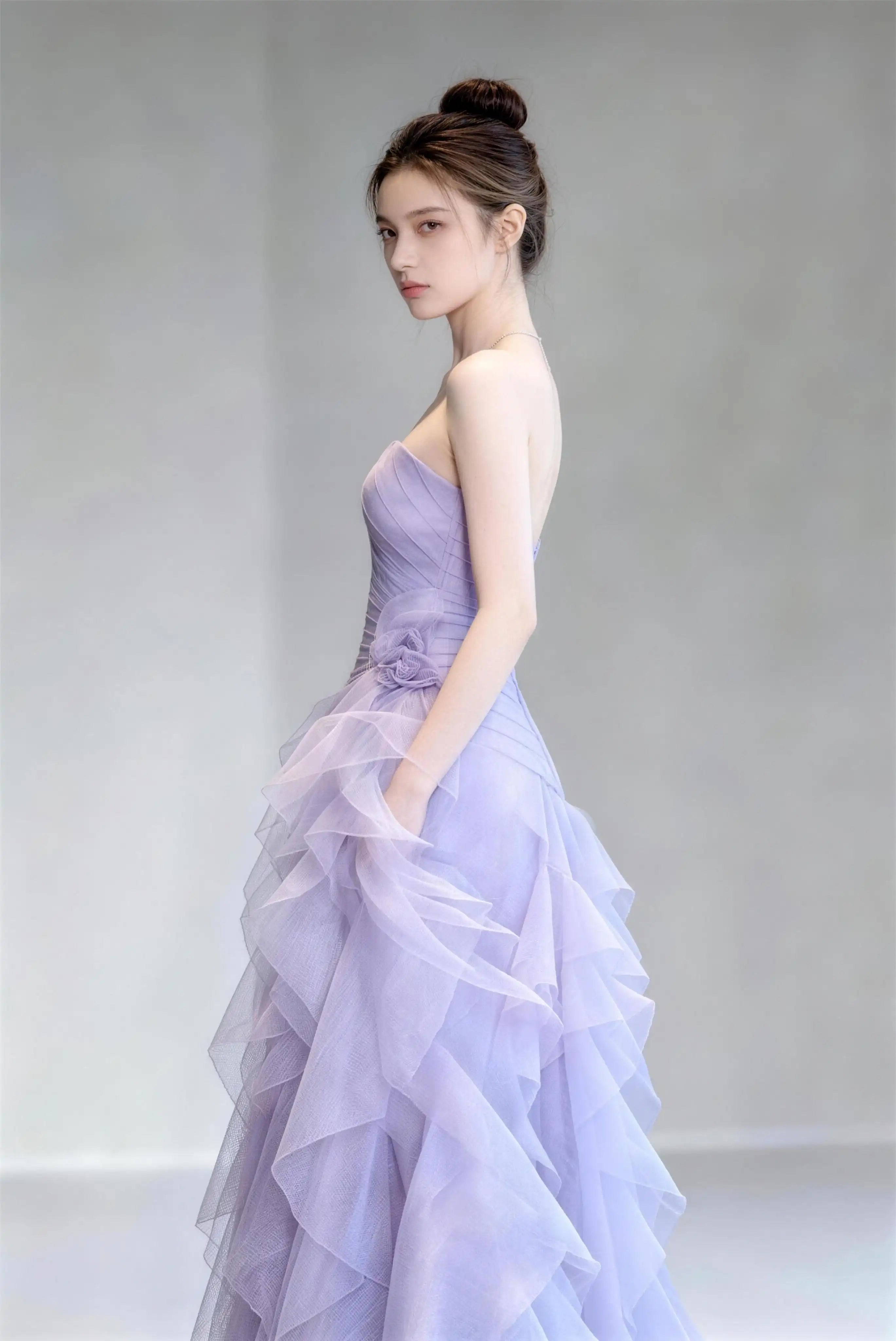 Phoehua Side Detail View of Light Purple Fairy‑Core Formal Evening Dress, Strapless Ruched‑Bodice With 3D Floral Accent Lace‑Up‑Back Layered‑Ruffle Tulle Mermaid Gown