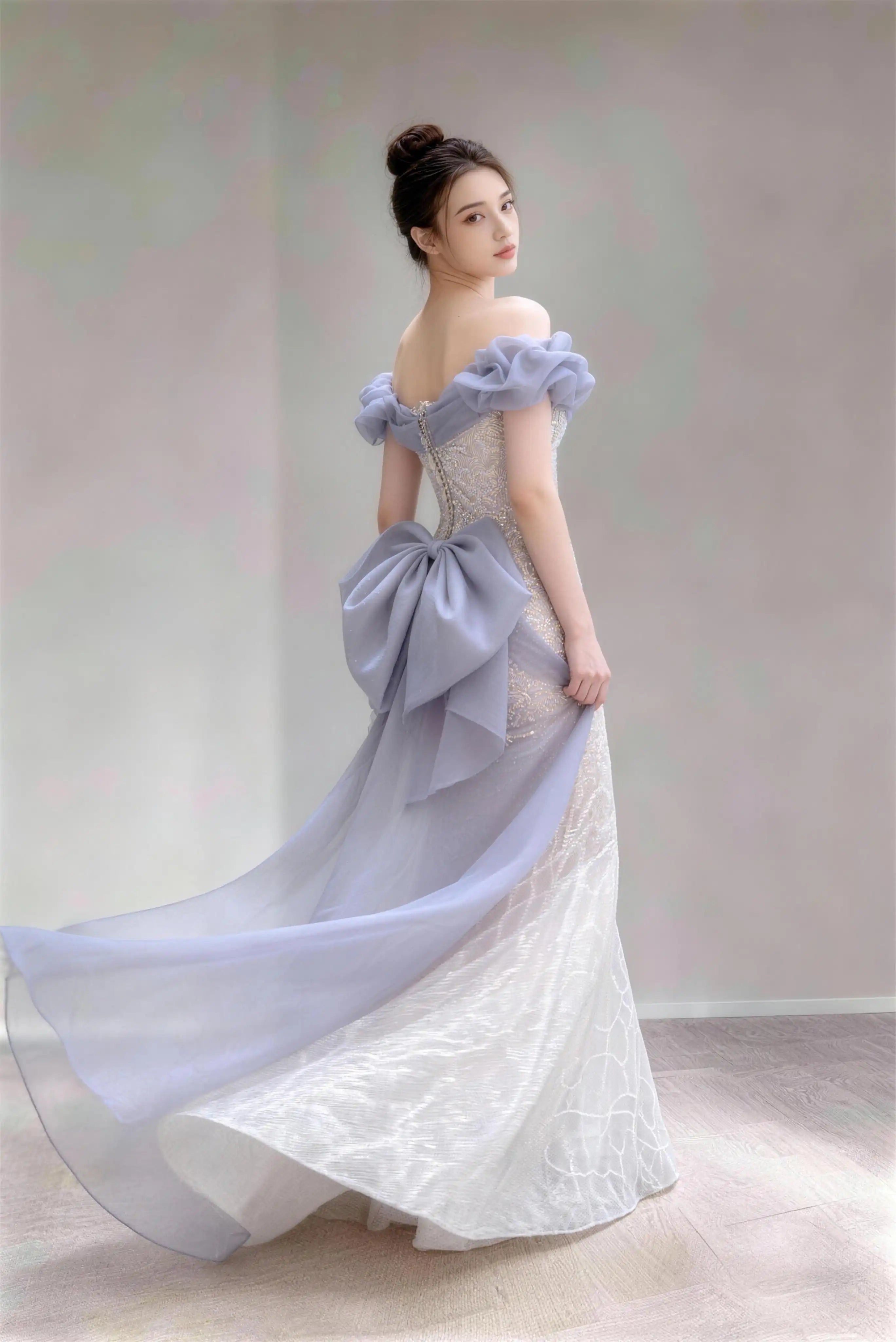 Phoehua Side Twirl View of Dusty Blue Dreamy Romantic Evening Gown, Off‑Shoulder Puff‑Cuff Lace‑Up‑Back Large‑Bow Sequined‑Branch‑Embroidered Mermaid Formal Dress