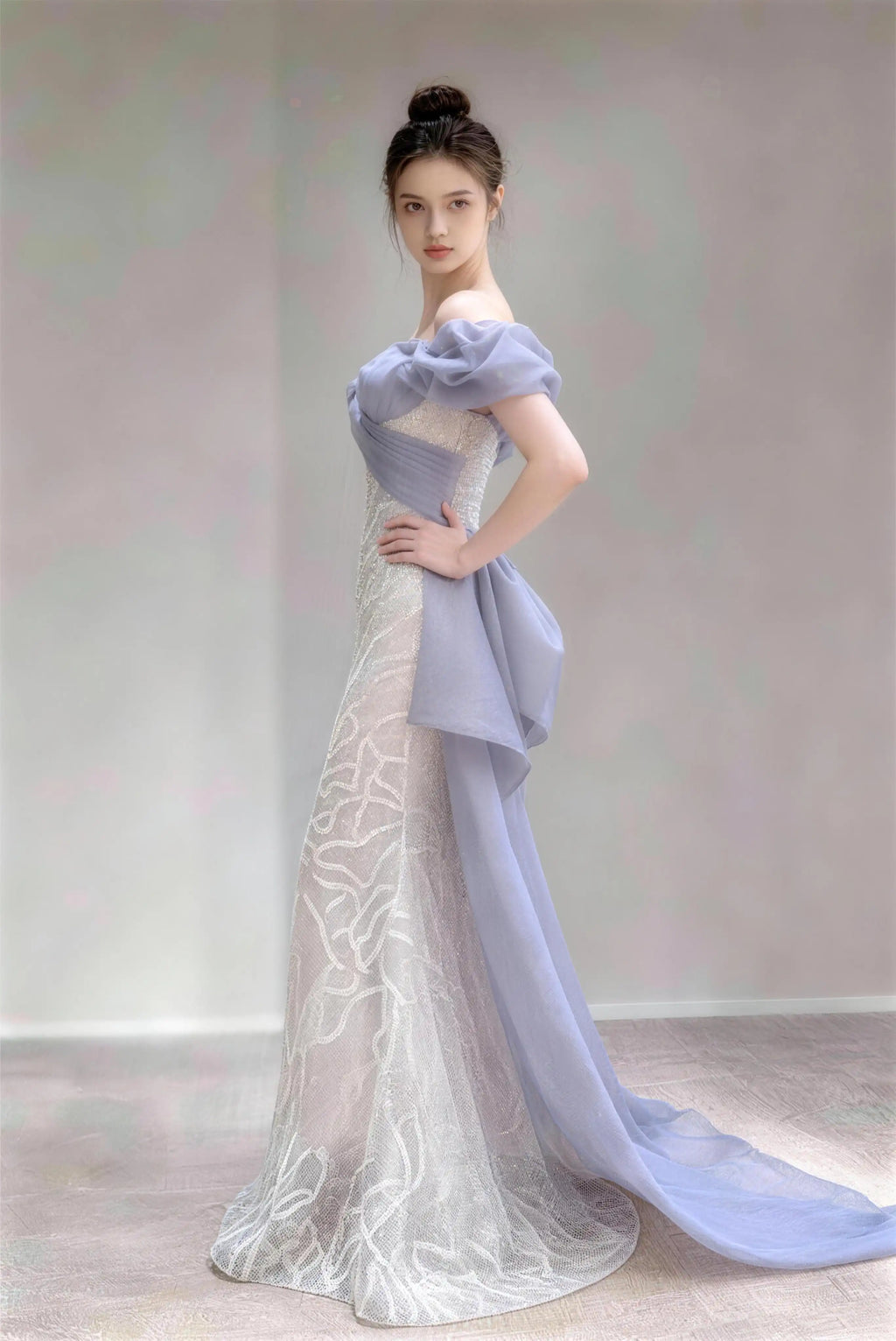 Model wearing sky-blue dusty blue off‑shoulder bow sequined mermaid formal evening gown