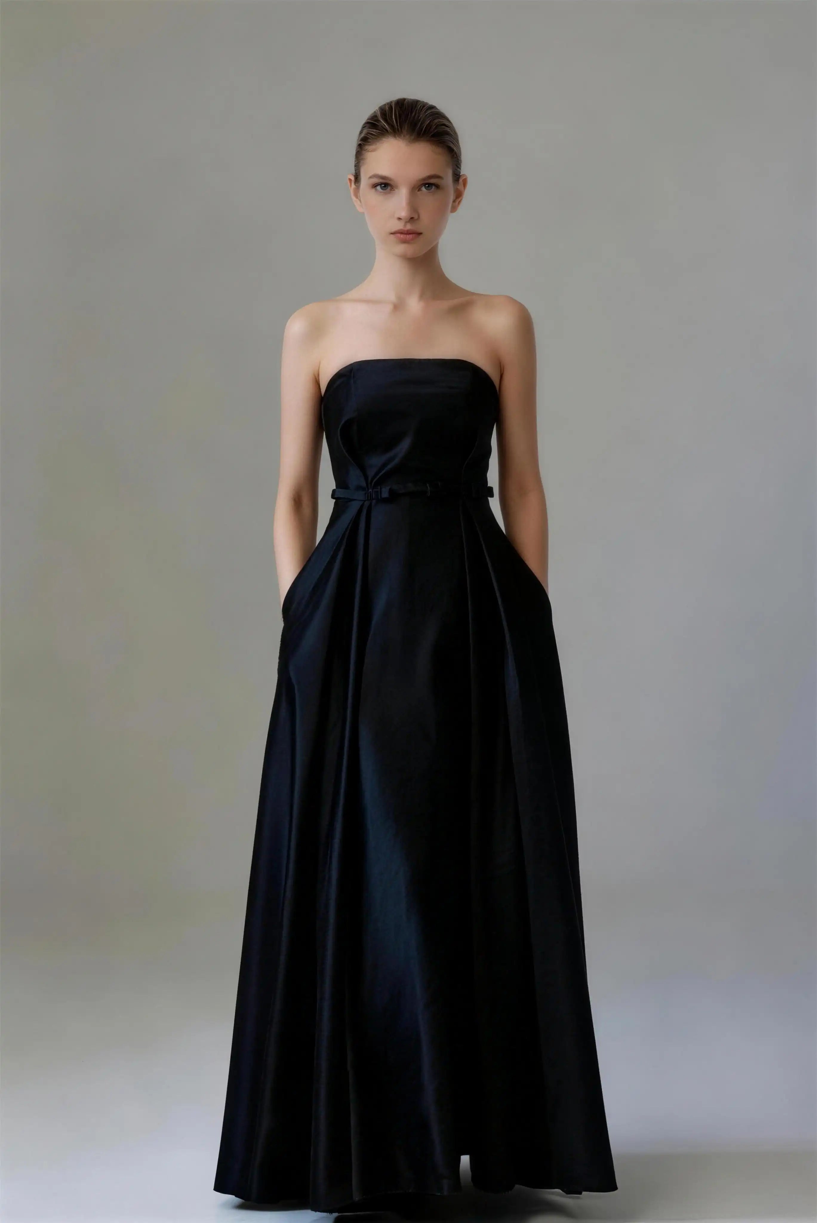 Phoehua Black Strapless Satin A‑Line Maxi Evening Gown, Front View Mid‑Rise Bow Belt Corset Lace‑Up Back Minimalist Elegant Formal Wedding Guest Bridesmaid Dress With Side Pockets