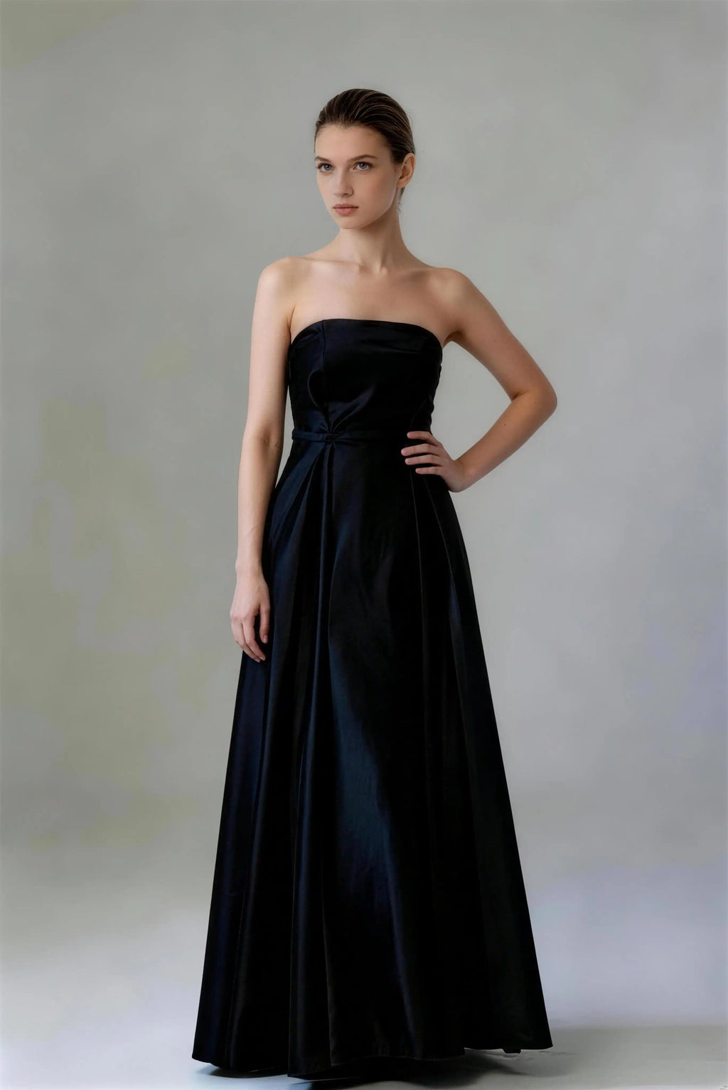 Phoehua Front Side Pose of Black Luxury Formal Prom Dress, Strapless Bow‑Belt Lace‑Up‑Back Mid‑Rise Satin A‑Line Maxi Bridesmaid Evening Gown