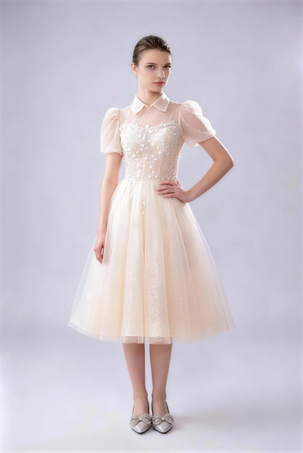 Phoehua Front Side Pose of Champagne Luxury Formal Prom Dress, Collared Puff‑Sleeve Tie‑Back Corset Beaded‑Floral High‑Waist A‑Line Midi Bridesmaid Evening Gown
