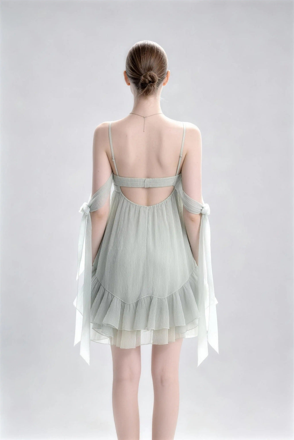 Phoehua Back View of Sage Green Spaghetti Strap Casual Mini Dress, Backless Elastic‑Waist Bow‑Tie‑Strap Ruffle‑Hem A‑Line Vacation Evening Dress