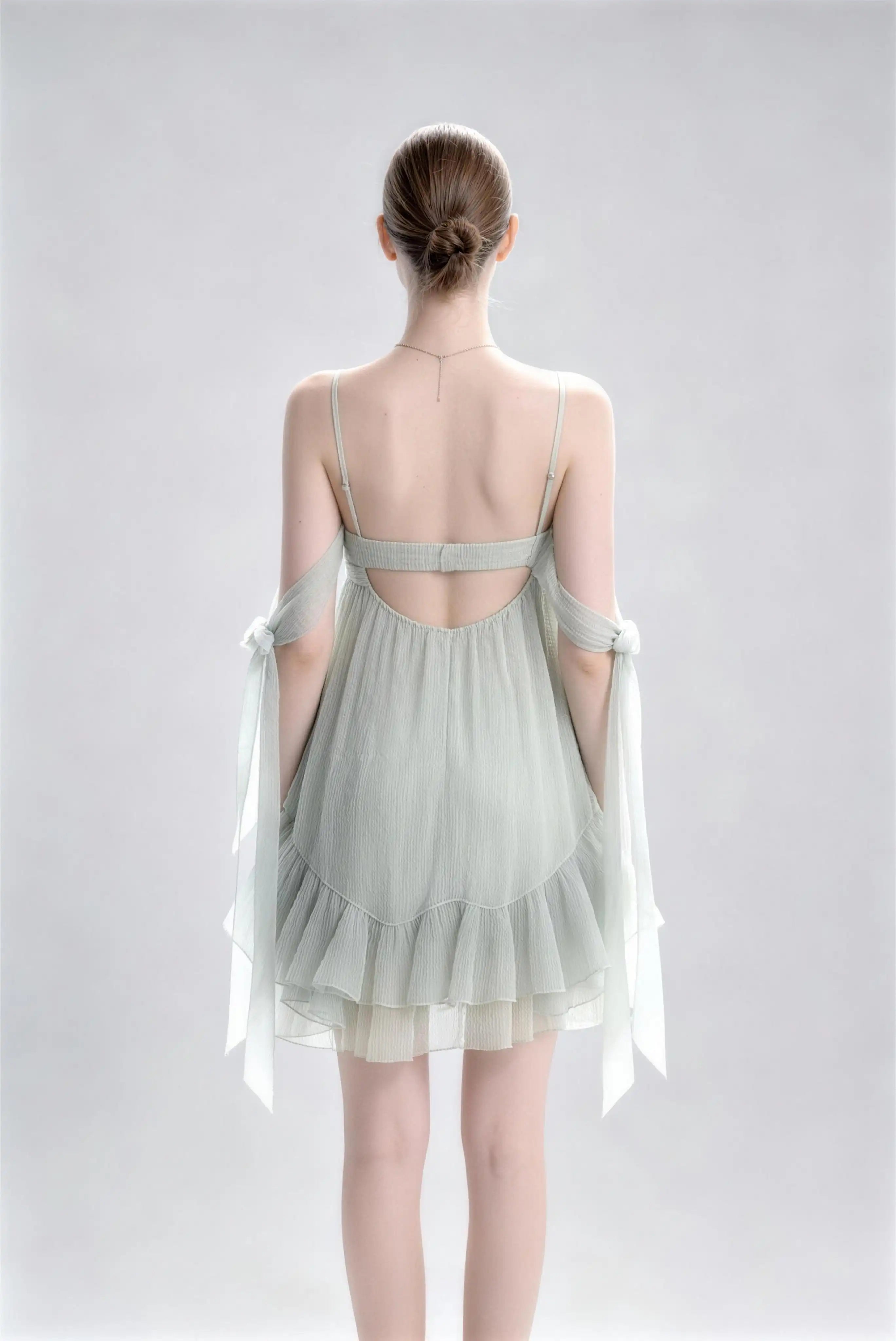 Phoehua Back View of Sage Green Spaghetti Strap Casual Mini Dress, Backless Elastic‑Waist Bow‑Tie‑Strap Ruffle‑Hem A‑Line Vacation Evening Dress
