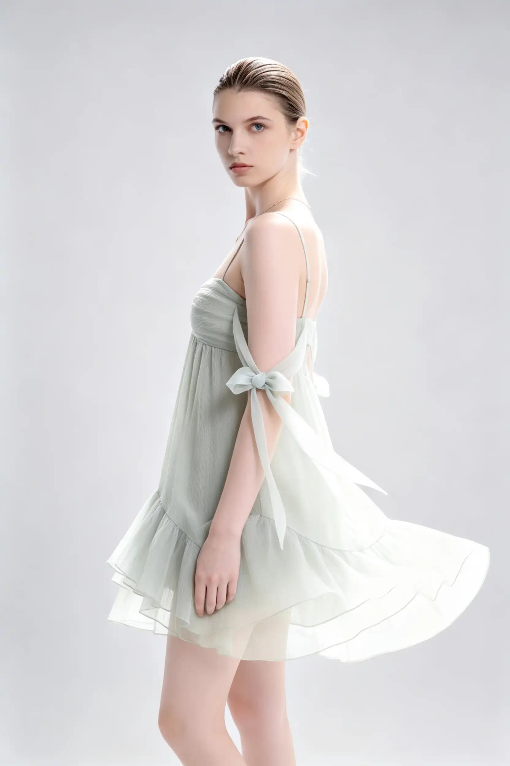 Phoehua Side Profile View of Sage Green Sexy Casual Party Dress, Spaghetti‑Strap Bow‑Tie‑Strap Backless Crinkled‑Chiffon Ruffle‑Hem A‑Line Mini Dress