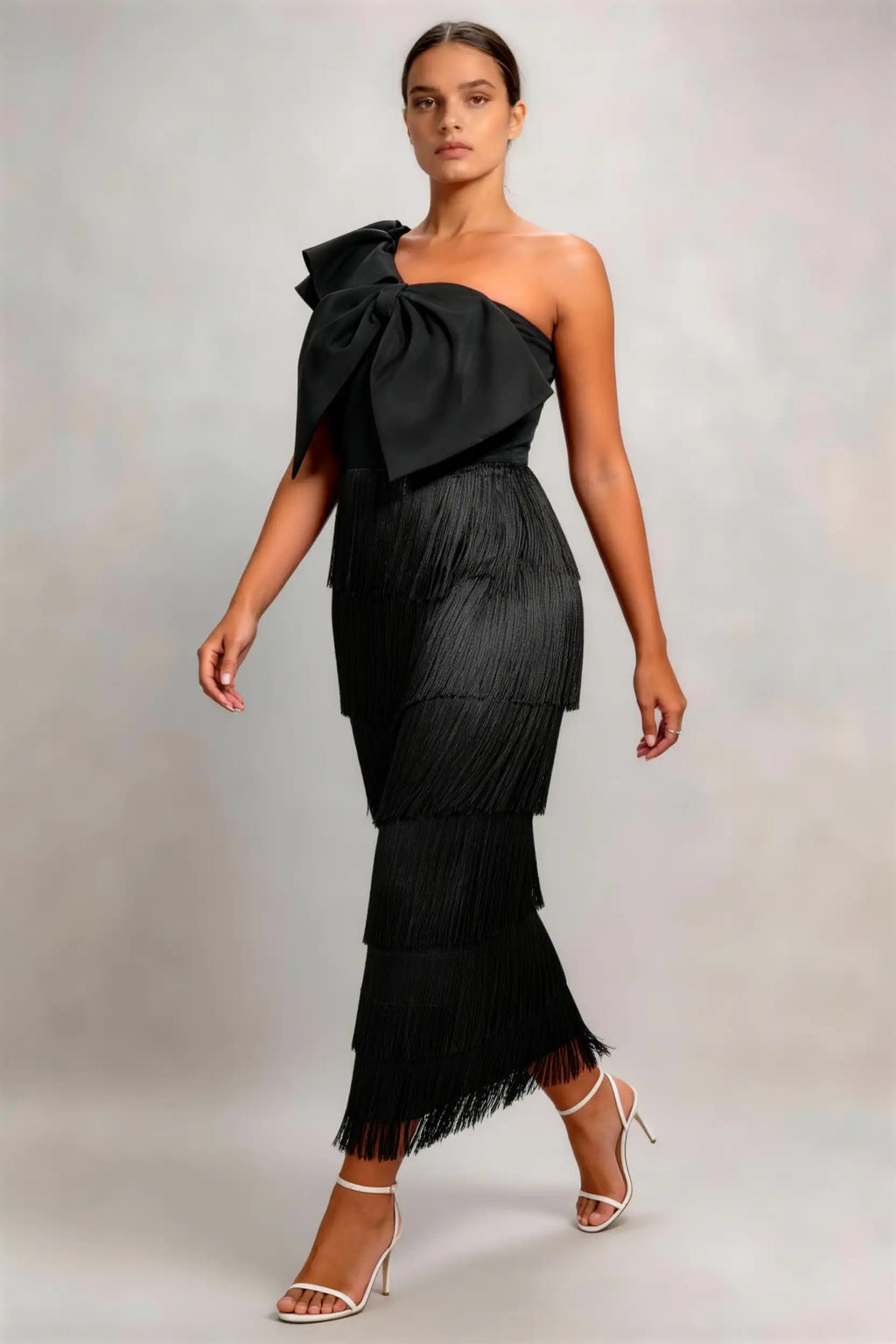 Phoehua Side Twirl‑Pose View of Black Elegant Formal Dress, One‑Shoulder Oversized‑Bow Tiered‑Tassel Fringe Asymmetrical‑Neck Slim Evening Cocktail Midi Dress