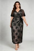 Front view of plus size black floral lace wrap midi dress with flutter sleeves