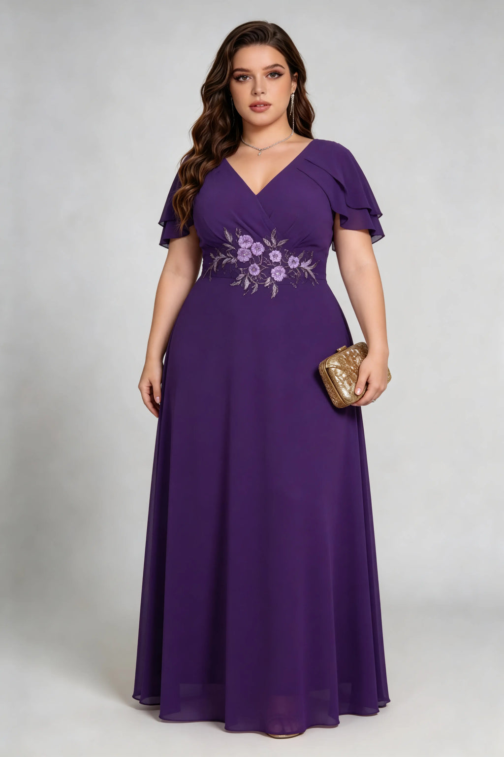 Plus size woman wearing purple floral embroidered chiffon maxi dress with ruffled sleeves, full length view
