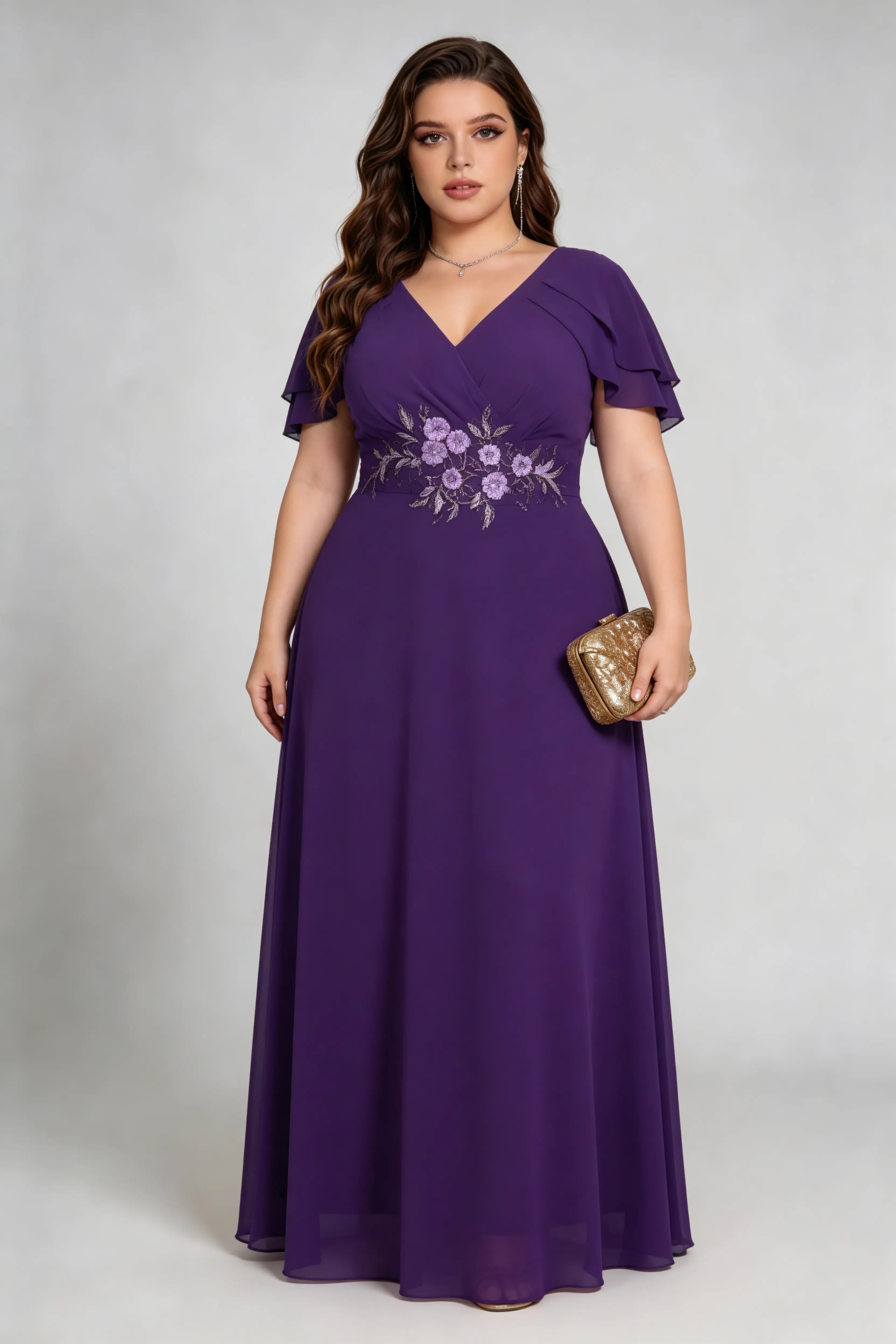 Plus size woman wearing purple floral embroidered chiffon maxi dress with ruffled sleeves, full length view