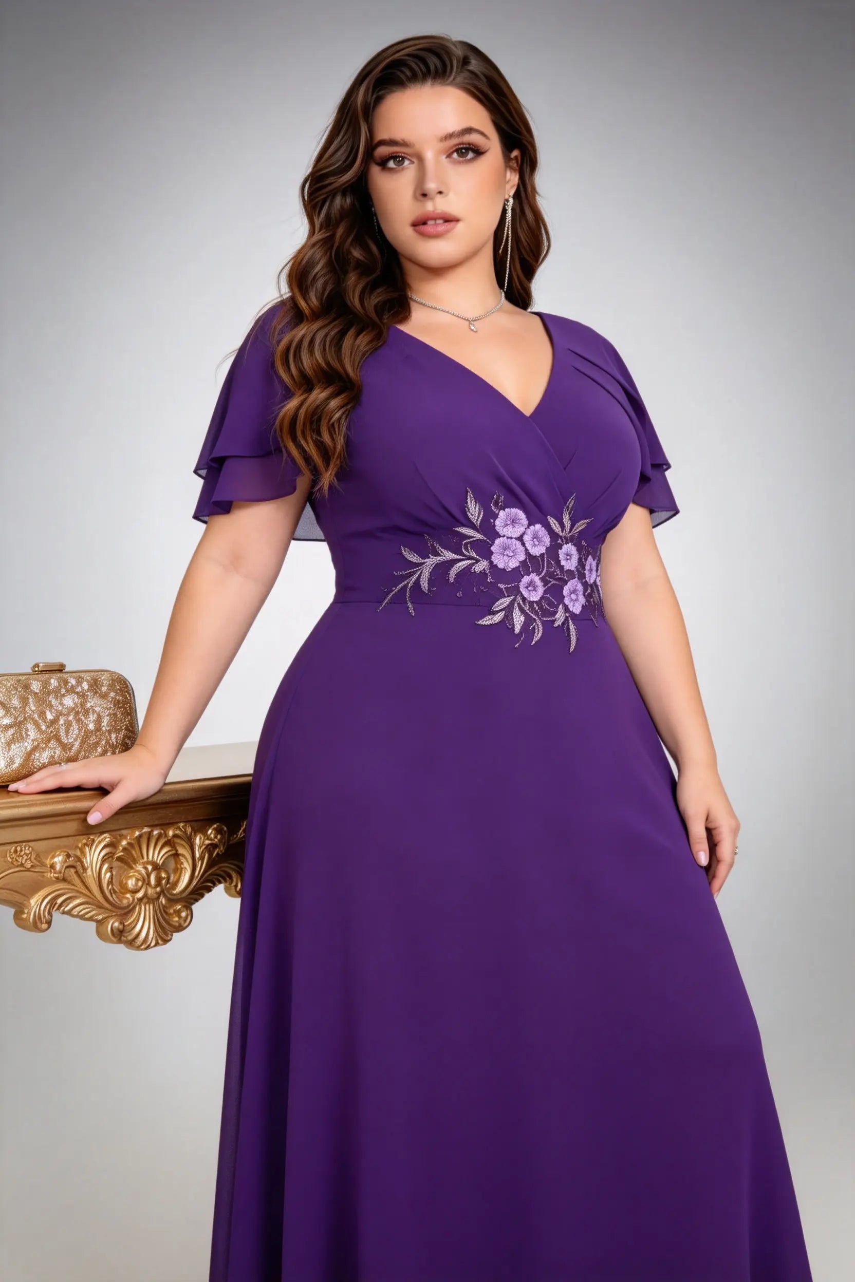 Plus size woman wearing purple floral embroidered chiffon maxi dress with ruffled sleeves, full length view