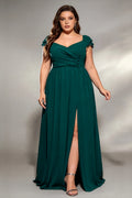 Curvy model wearing plus size dark-green sweetheart ruched maxi dress - elegant emerald green chiffon gown with thigh slit