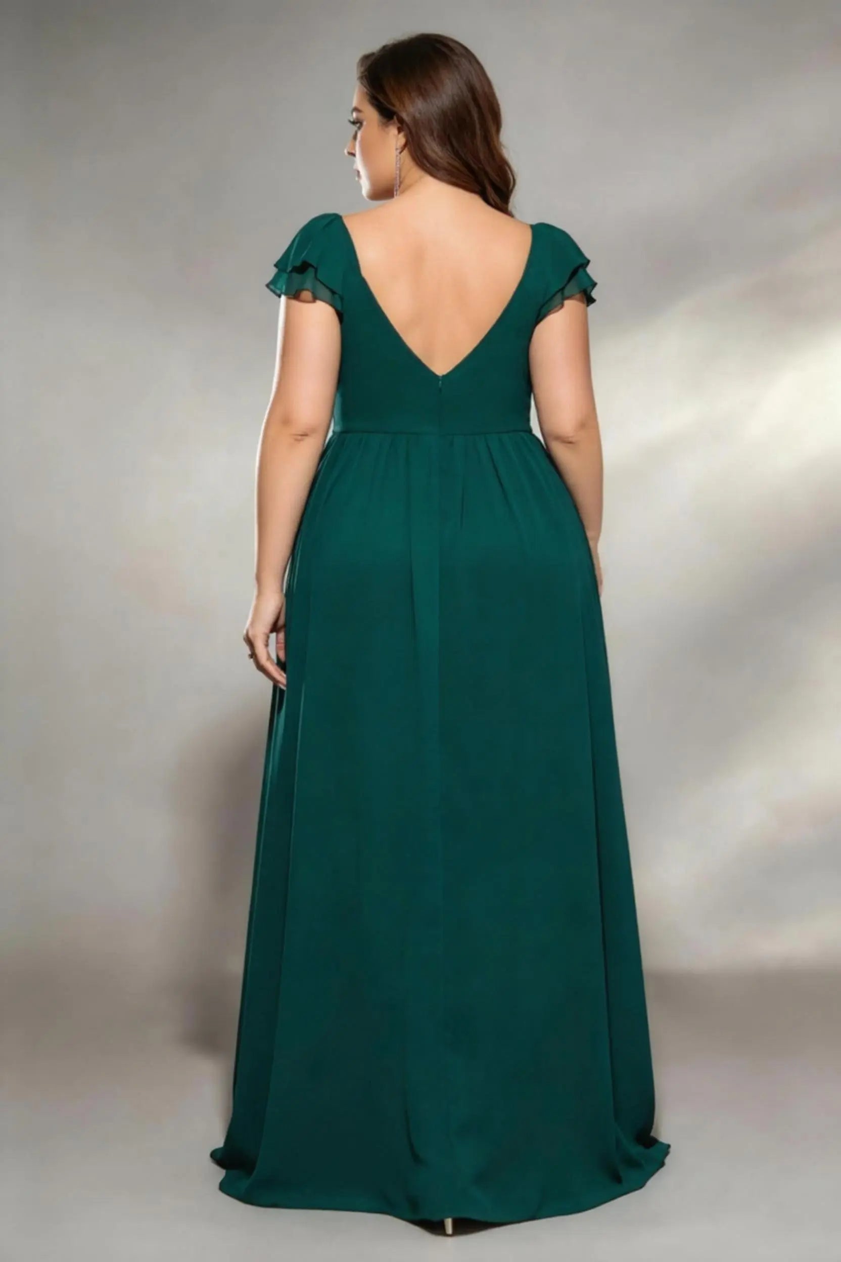 Curvy model wearing plus size dark-green sweetheart ruched maxi dress - elegant emerald green chiffon gown with thigh slit