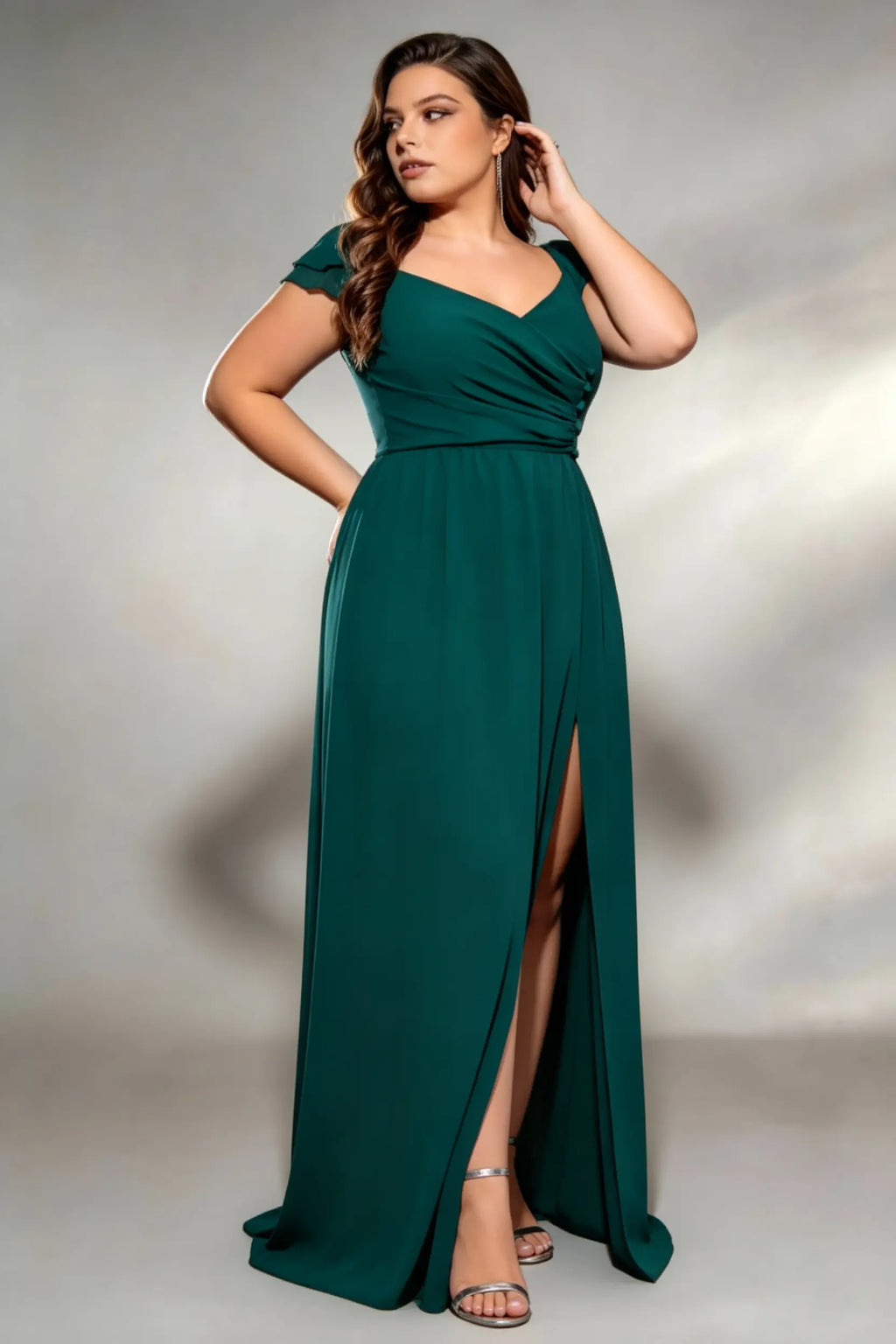 Curvy model wearing plus size dark-green sweetheart ruched maxi dress - elegant emerald green chiffon gown with thigh slit