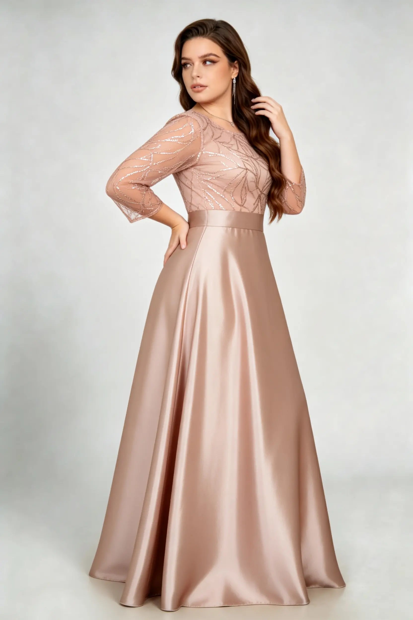 Curvy model wearing plus size sequin mesh boat neck evening gown - elegant rose gold satin a-line maxi dress