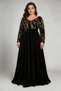 Curvy model wearing plus size black elegant v-neck velvet maxi dress with gold floral embroidery