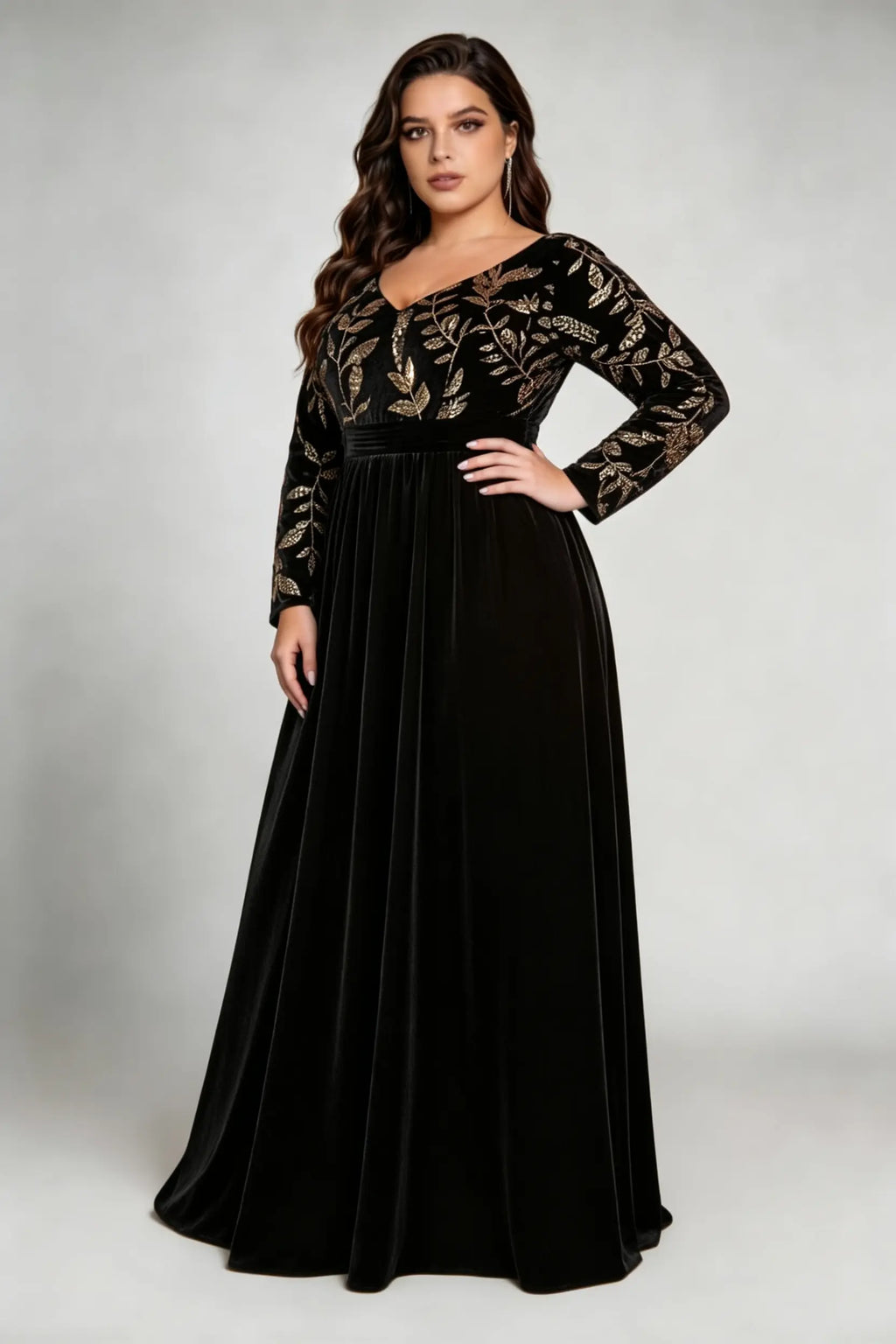Curvy model wearing plus size black elegant v-neck velvet maxi dress with gold floral embroidery