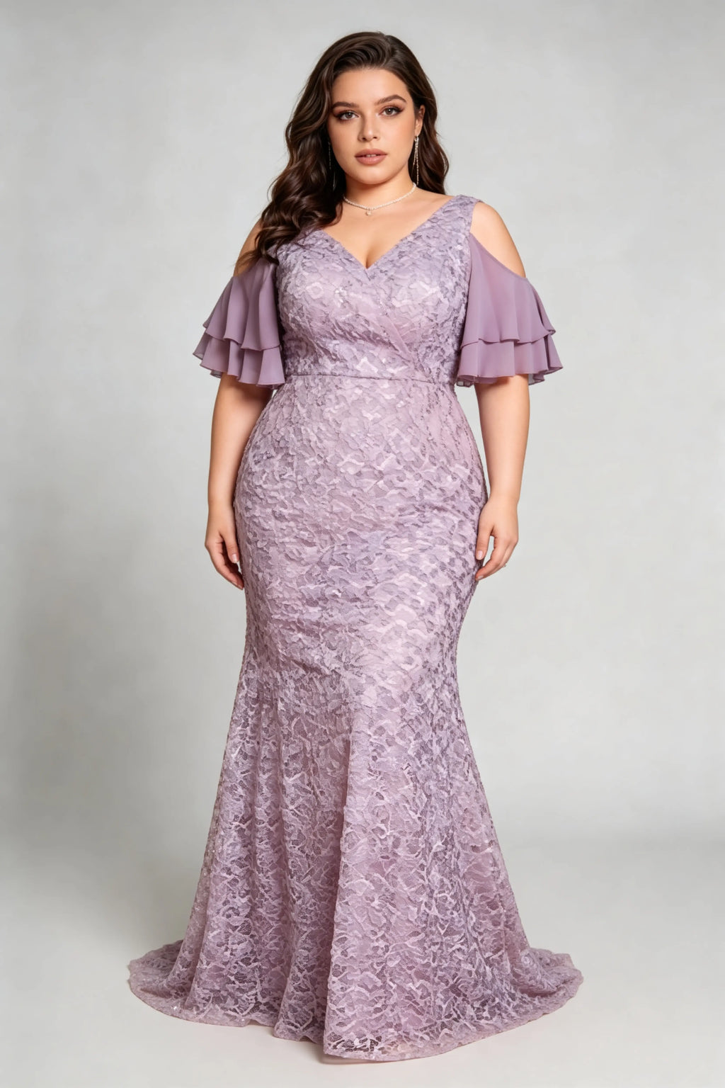 Curvy model wearing plus size purple cold-shoulder lace mermaid evening gown with tiered flutter sleeves