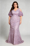 Curvy model wearing plus size purple cold-shoulder lace mermaid evening gown with tiered flutter sleeves