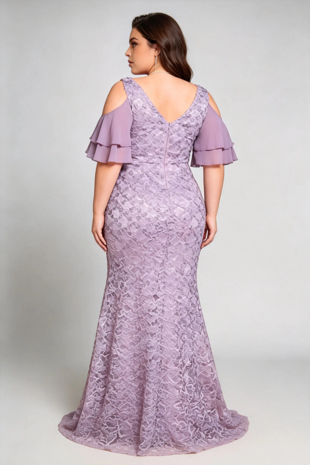 Curvy model wearing plus size purple cold-shoulder lace mermaid evening gown with tiered flutter sleeves