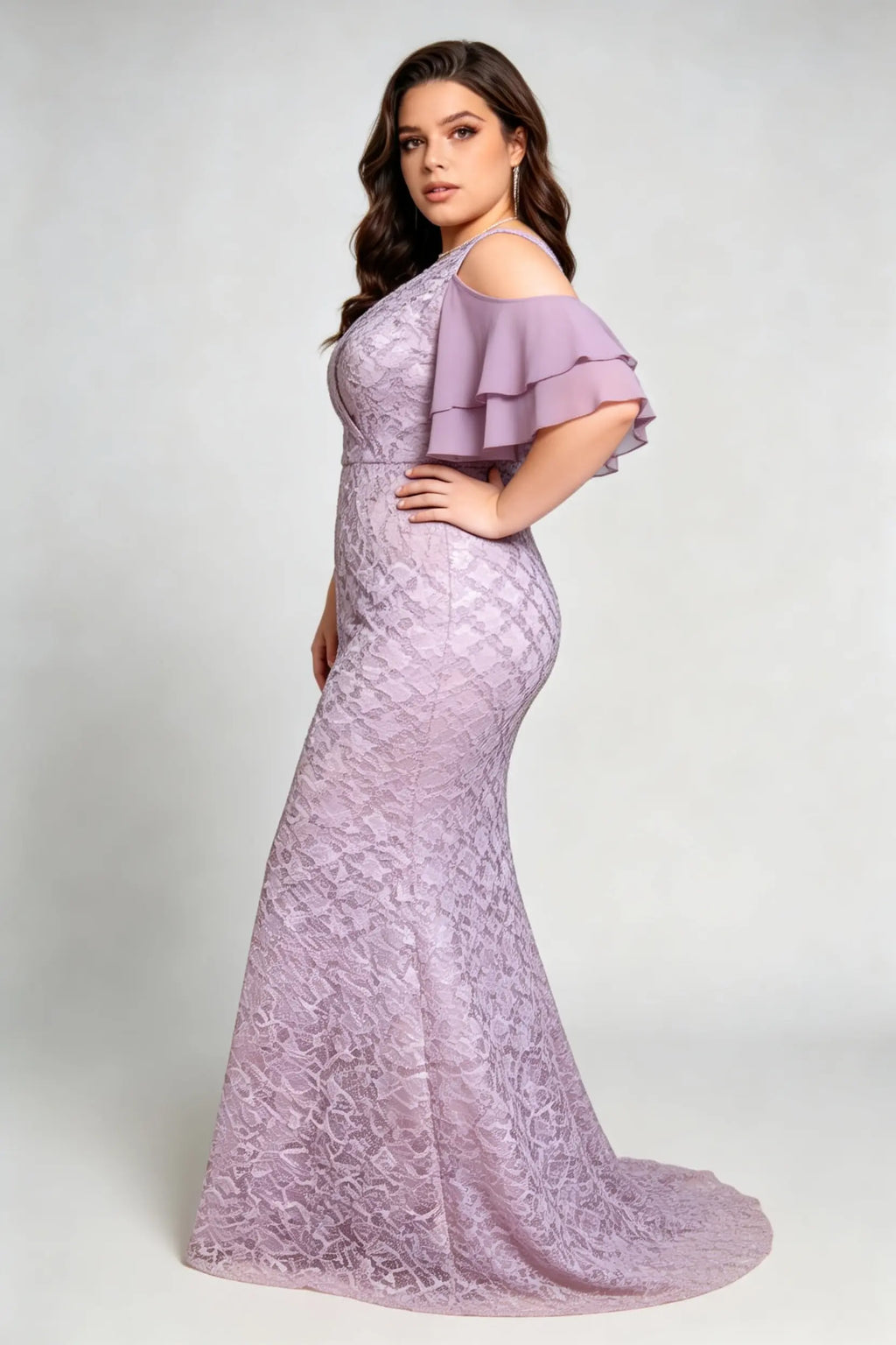 Curvy model wearing plus size purple cold-shoulder lace mermaid evening gown with tiered flutter sleeves