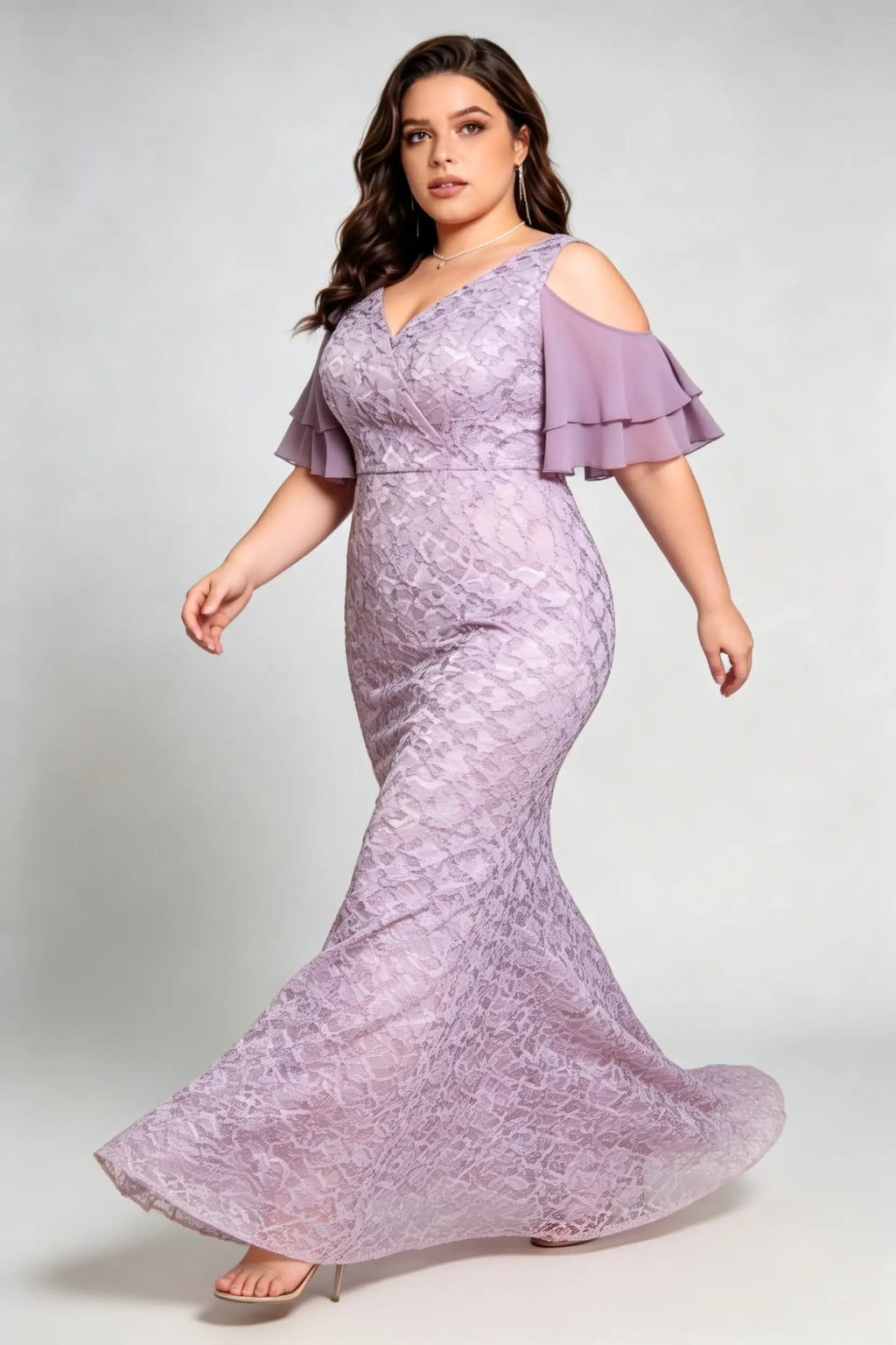 Curvy model wearing plus size purple cold-shoulder lace mermaid evening gown with tiered flutter sleeves
