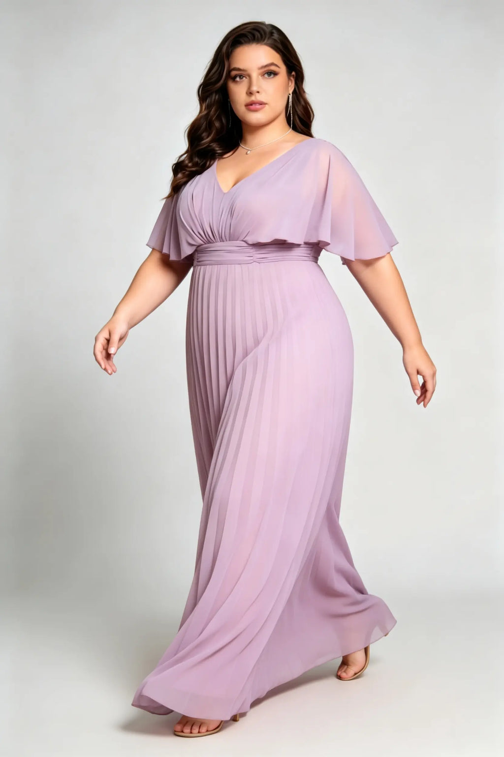 Curvy model wearing plus size purple v-neck pleated chiffon maxi evening dress with flutter sleeves