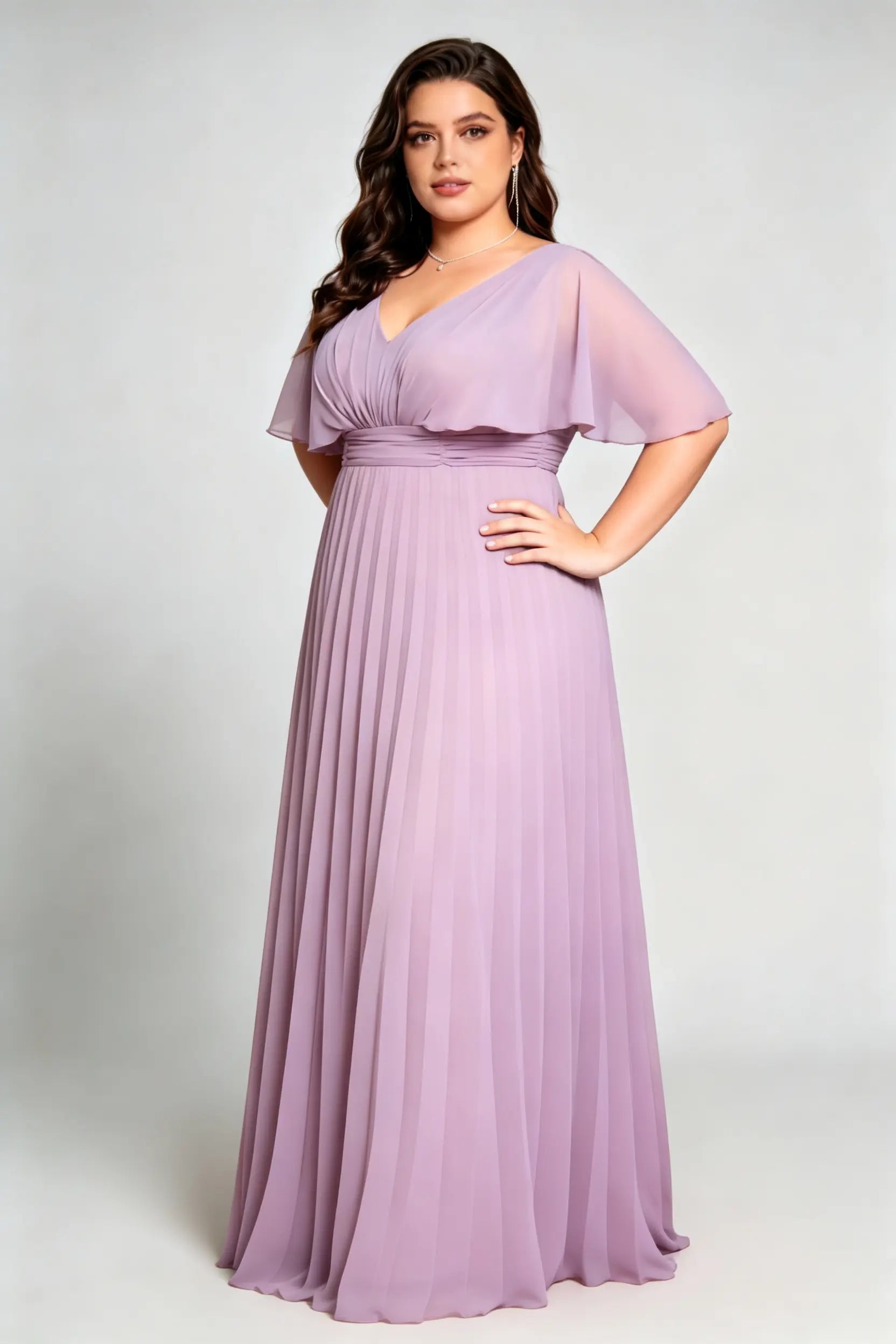 Curvy model wearing plus size purple v-neck pleated chiffon maxi evening dress with flutter sleeves