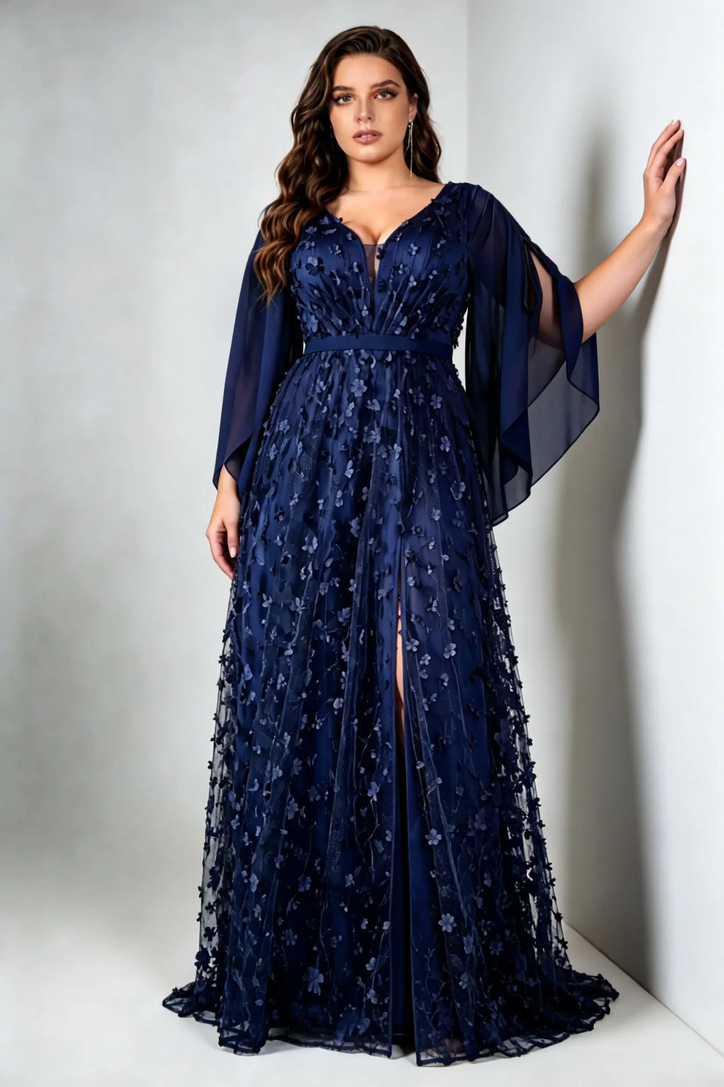Curvy model wearing plus size navy blue 3d floral applique evening gown – elegant v-neck cape sleeve formal maxi dress with slit (xl-4xl)