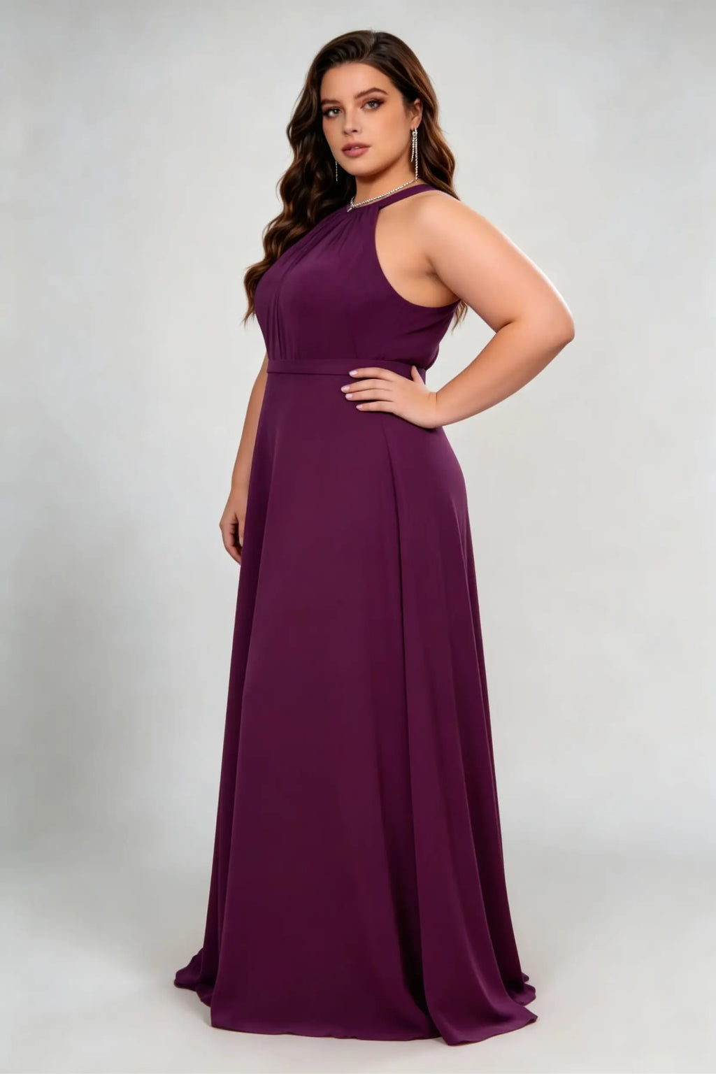 Curvy model wearing plus size burgundy dark plum halter neck evening gown – elegant pleated chiffon a-line formal maxi dress