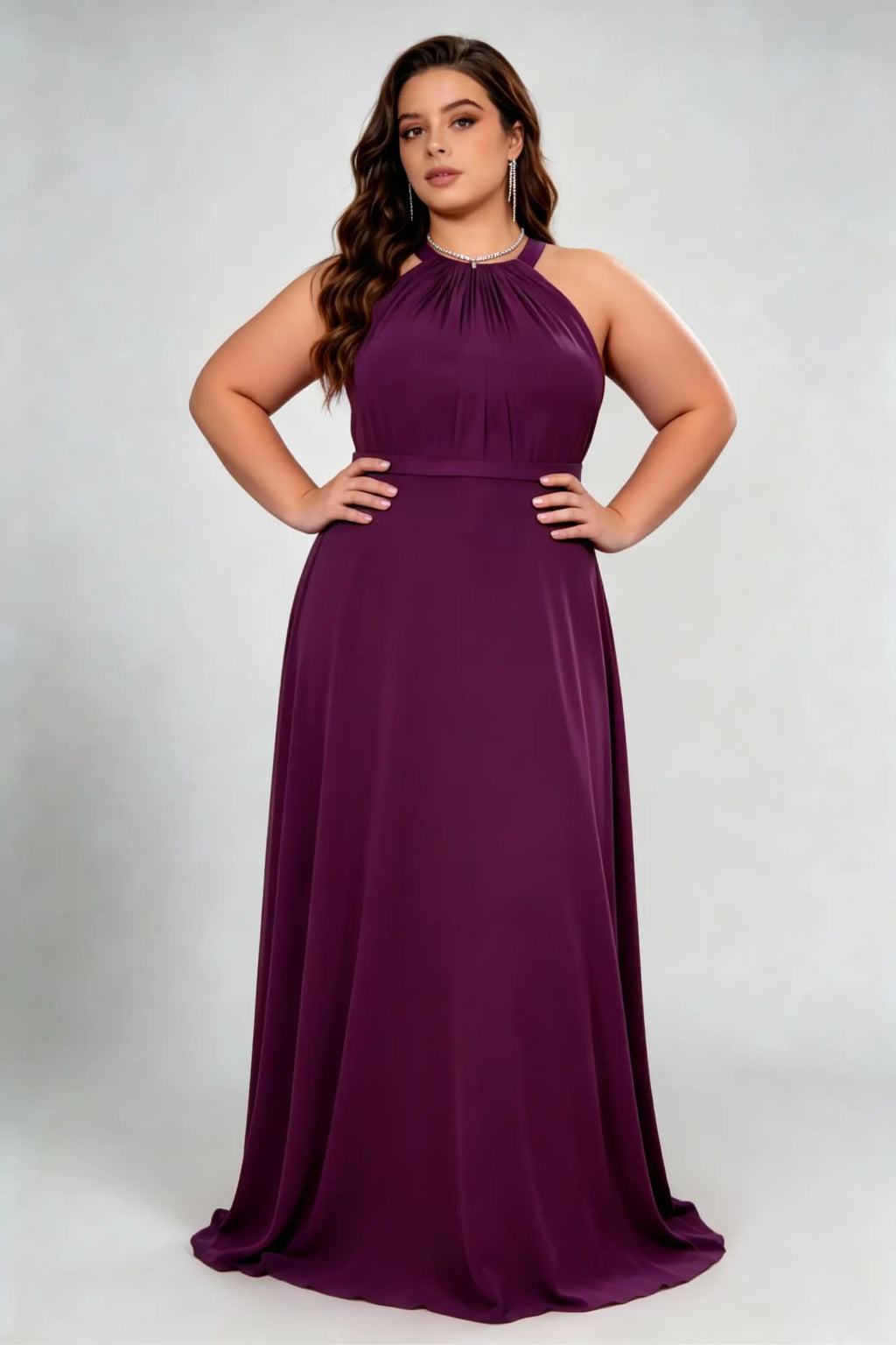 Curvy model wearing plus size burgundy dark plum halter neck evening gown – elegant pleated chiffon a-line formal maxi dress